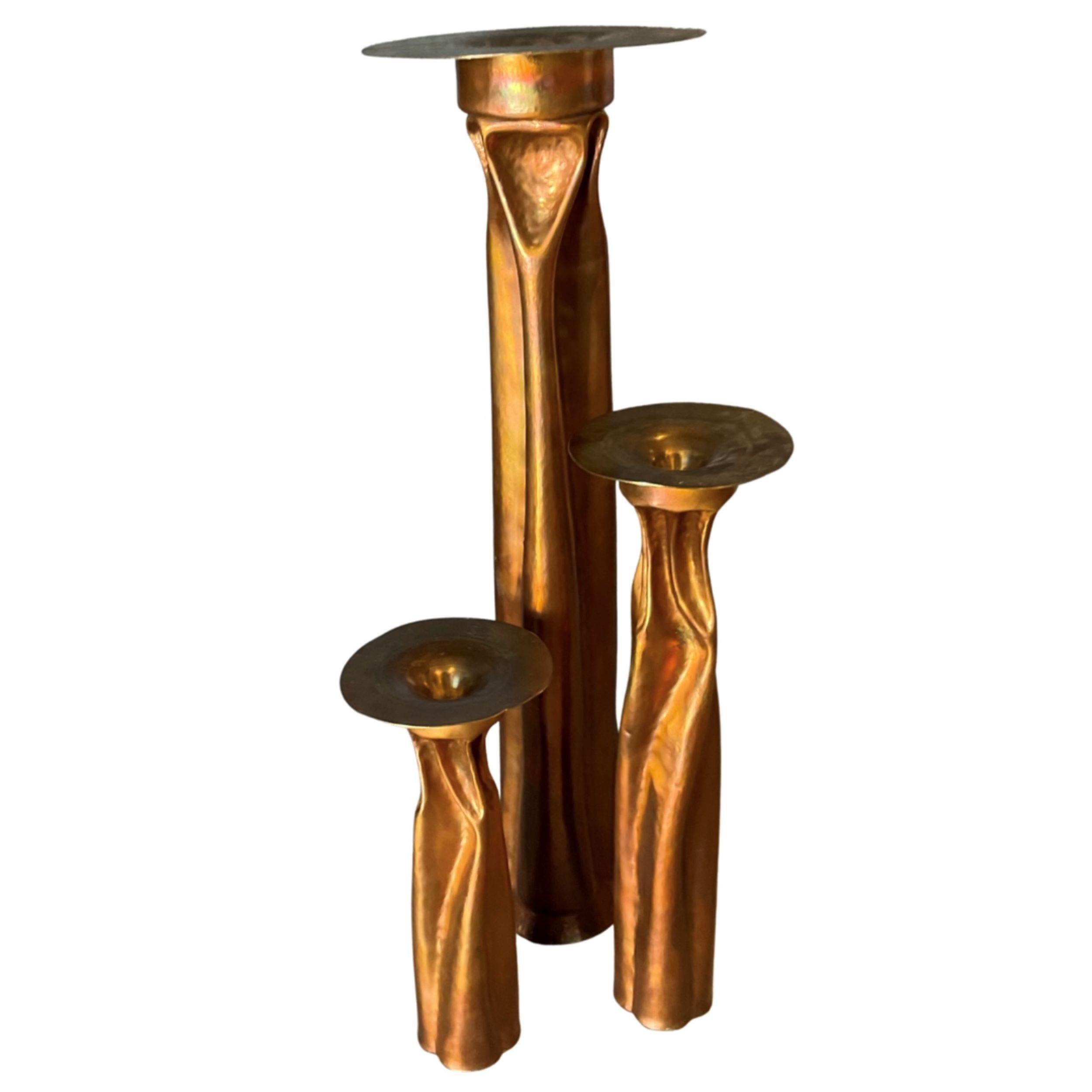 Thomas Roy Markusen (TRM).
1970's Abstract design copper candle holders.
Set of 3 in varying heights.
Hand-crafted & stamped 