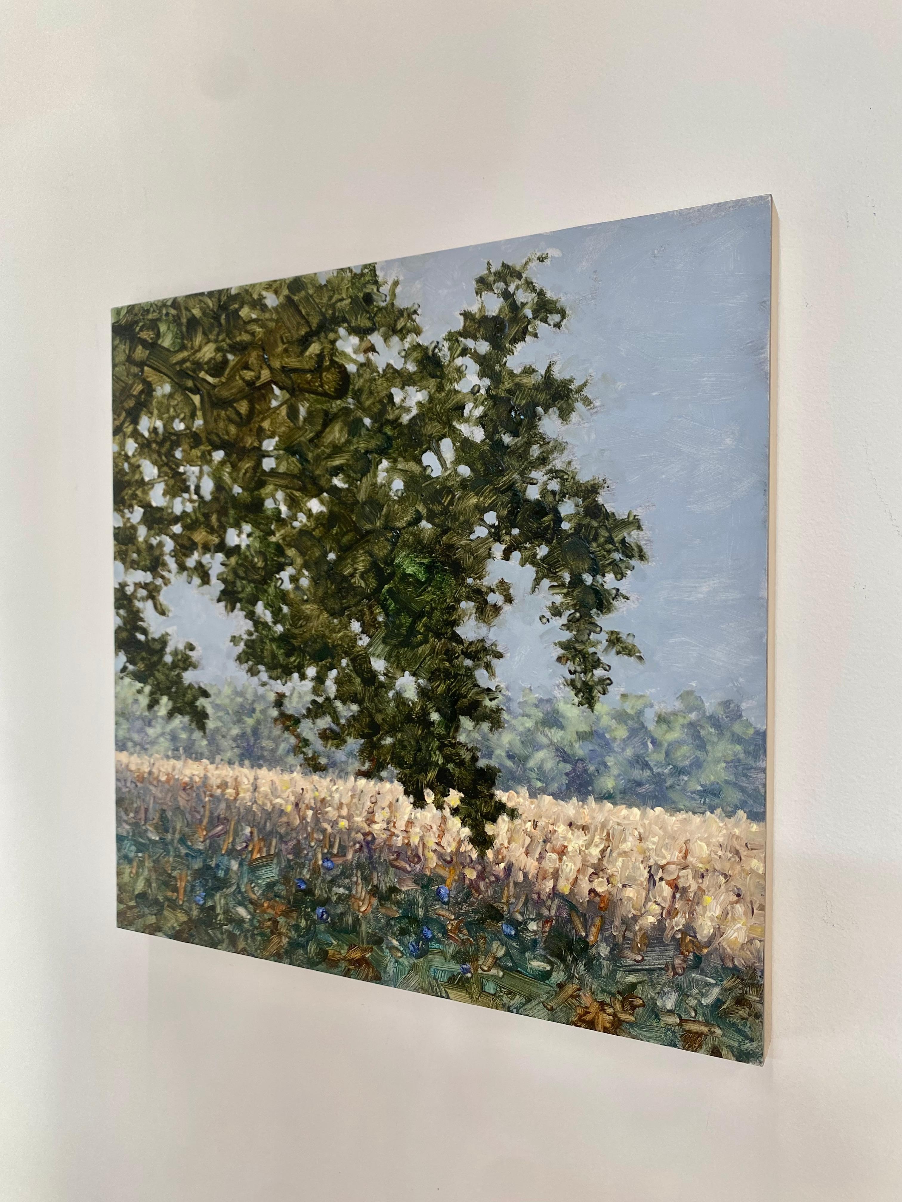 A peaceful outdoor scene of a delicately painted field with lavender and periwinkle blue flowers beneath a tree with dark olive green leaves, beautifully capturing the idyllic feel of a field of wildflowers in mid-September. Signed, dated and titled