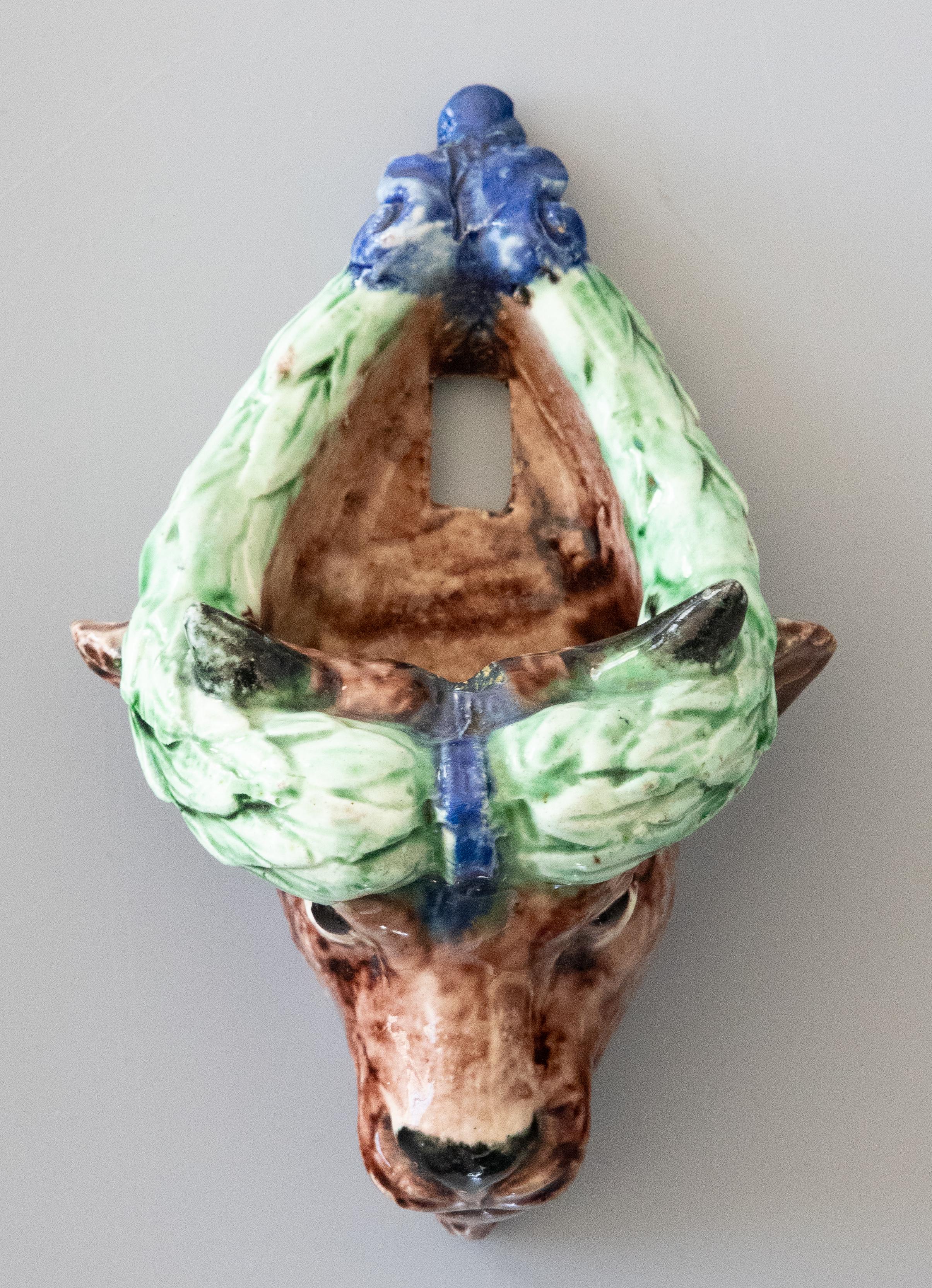 Thomas Sergent Palissy majolica bull's head in shades of blue, green, and brown. Circa 1890.
