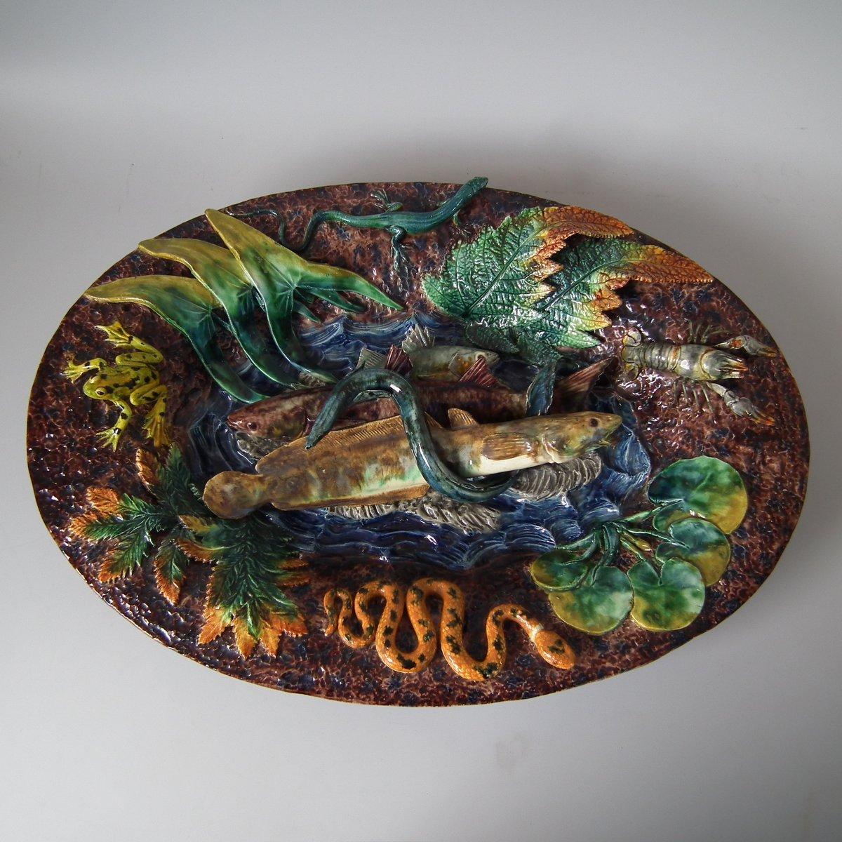 Thomas Sergent French Palissy Majolica wall platter which features three fish, an eel, a snake, a lizard, a crayfish and a frog. Colouration: brown, green, orange, are predominant. The piece bears maker's marks for the Thomas Sergent pottery.