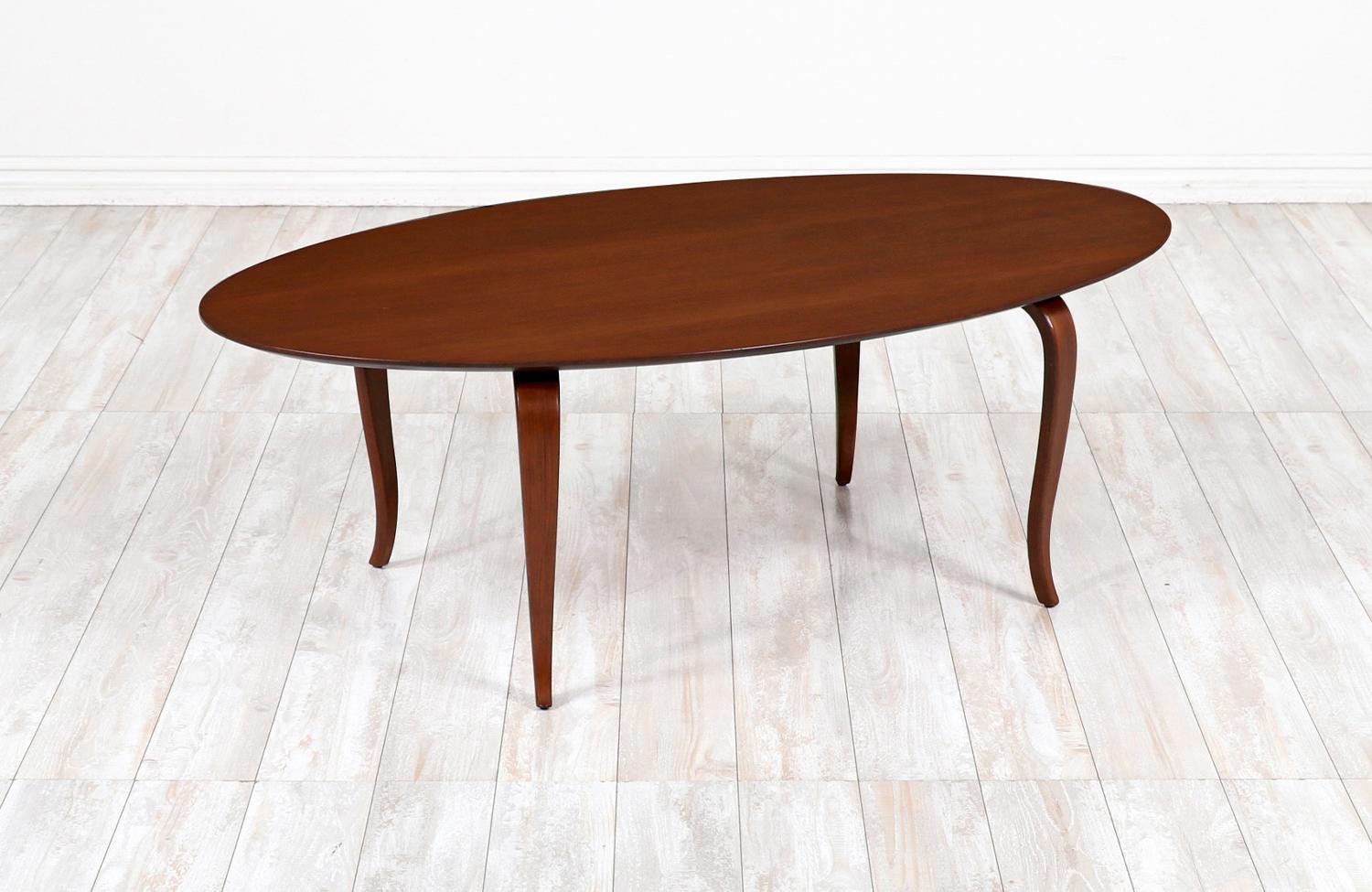 Thomas stender surfboard oval coffee table for Sigma.

________________________________________

Transforming a piece of Mid-Century Modern furniture is like bringing history back to life, and we take this journey with passion and precision. With