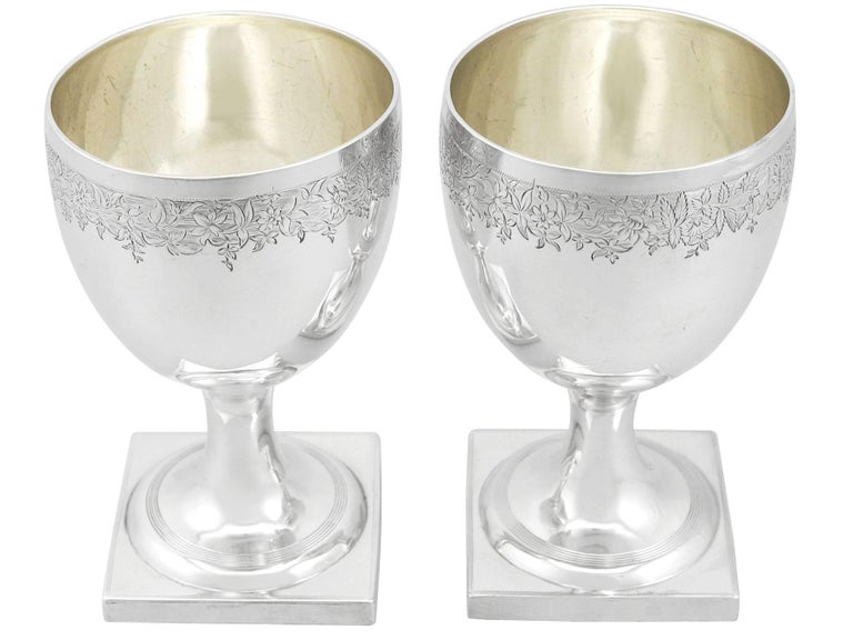 An exceptional, fine and impressive pair of antique Georgian English sterling silver goblets; an addition to our range of wine and drink related silverware.

These exceptional antique George III English sterling silver goblets have a plain