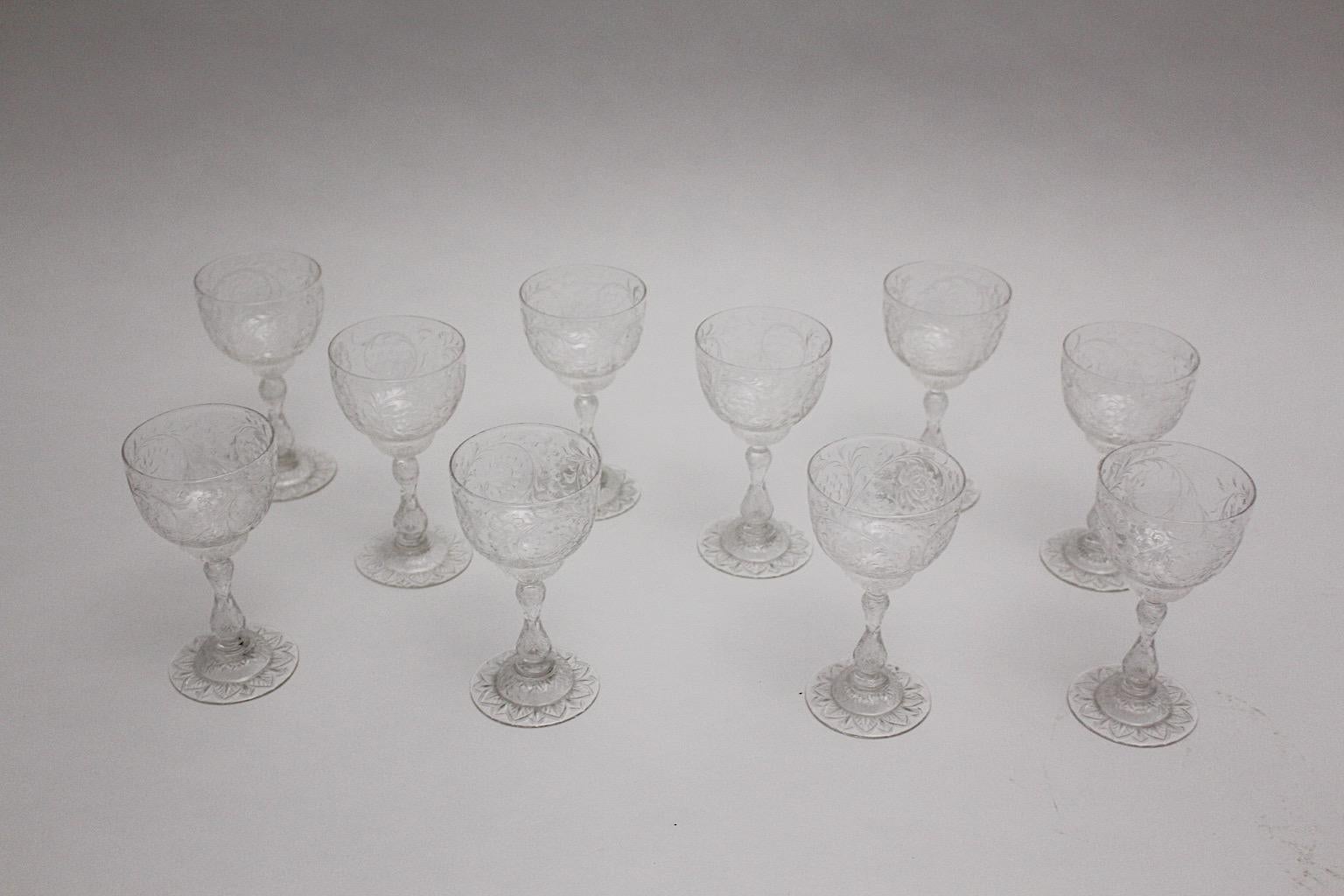 Thomas Webb and Sons attributed circa 1903, United Kingdom 
Jugendstil period ten ( 10 ) wine glasses cut and engrave glass ware set with delicate flower motifs.
Thomas Webb ( 1804 - 1869 ) English glassmaker and the founder of Thomas Webb and Sons,