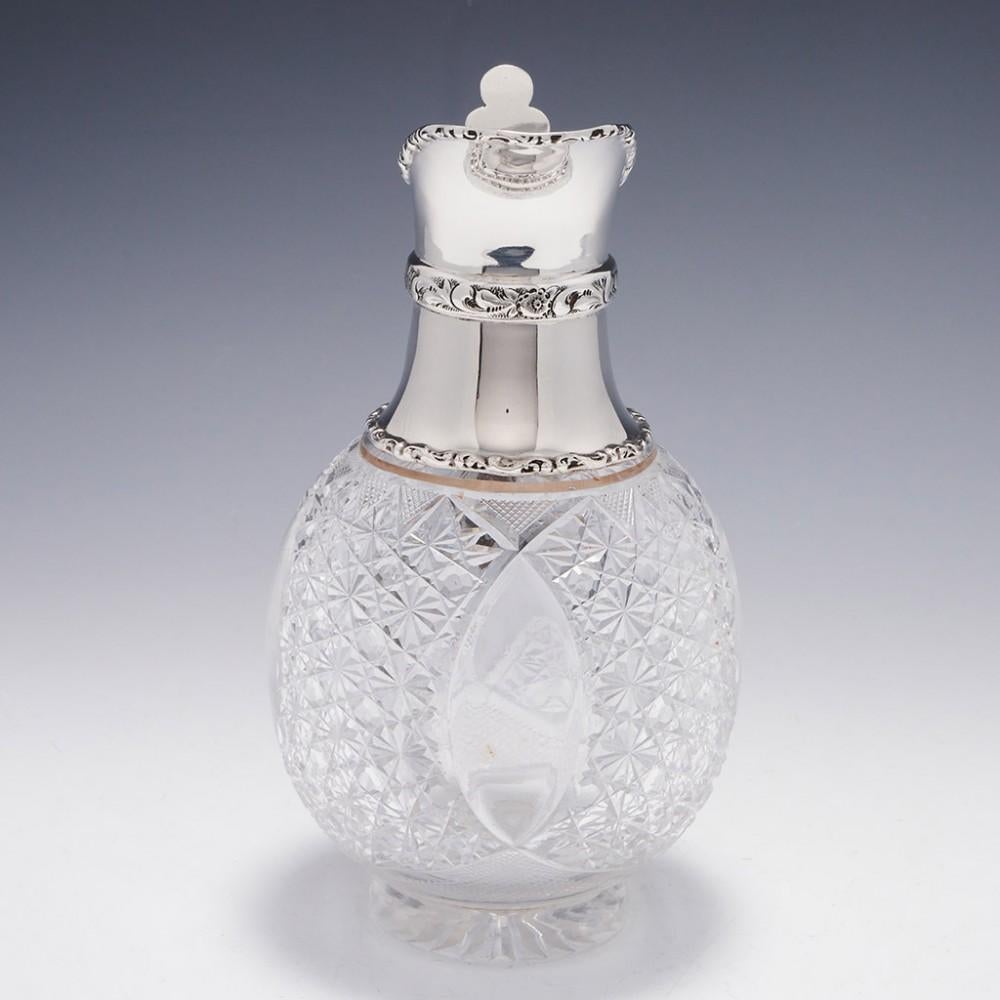 Heading : silver topped cut glass claret jug - c1908
Date : Hallmarked in Sheffield for Walker & Hall in 1908
Period : Edwardian
Origin : Glass Thomas Webb, Silver Sheffield, England
Decoration : The silver top has an applied repousse band with