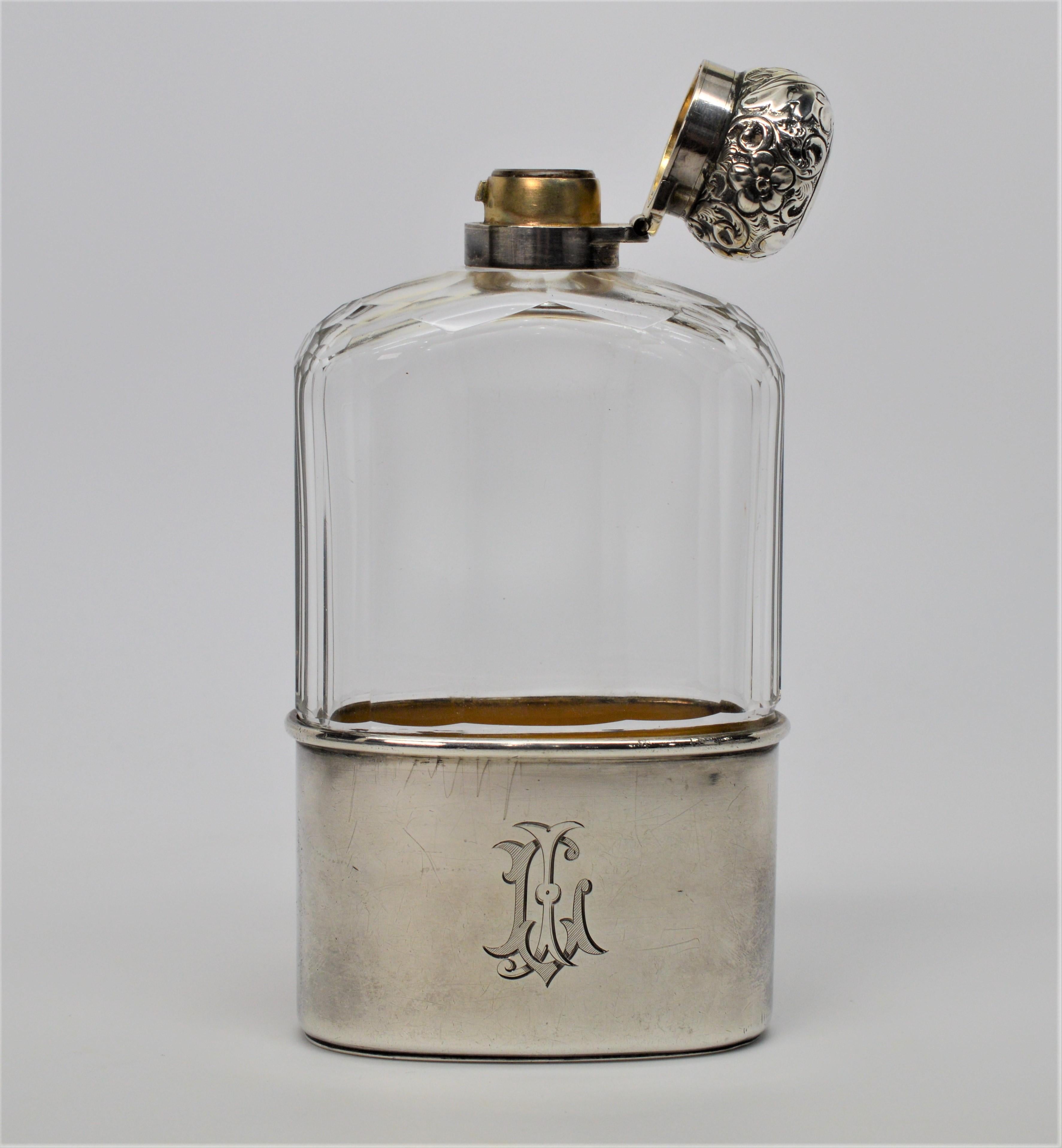 Gentleman's Sterling Silver and Leaded Glass Antique English Flask.  Six inches tall with removable bottom to form a cup. 
Measures 6 x 3 x 1 inches. In fabulous condition with hallmarks, Maker Thomas Wimbush, London 1896. 
