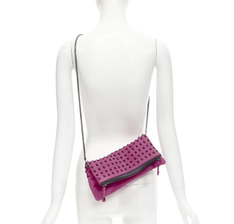 THOMAS WYLDE pink suede ruthenium skull studded foldover crossbody clutch bag
Reference: ANWU/A00951
Brand: Thomas Wylde
Material: Suede
Color: Pink
Pattern: Skull
Closure: Zip
Lining:  Fabric
Extra Details: Convertible. Can be worn as clutch,