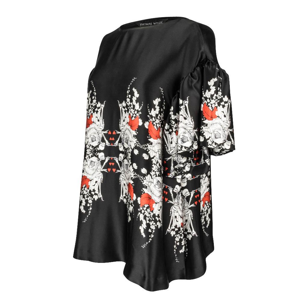 Guaranteed authentic Thoms Wylde black tunic silk top with winter white skeletons painting red hearts. 
Interspersed are vines accented with red leaves.
Sleeves are a flounce with a drop shoulder.
Wonderful dramatic piece from jeans to