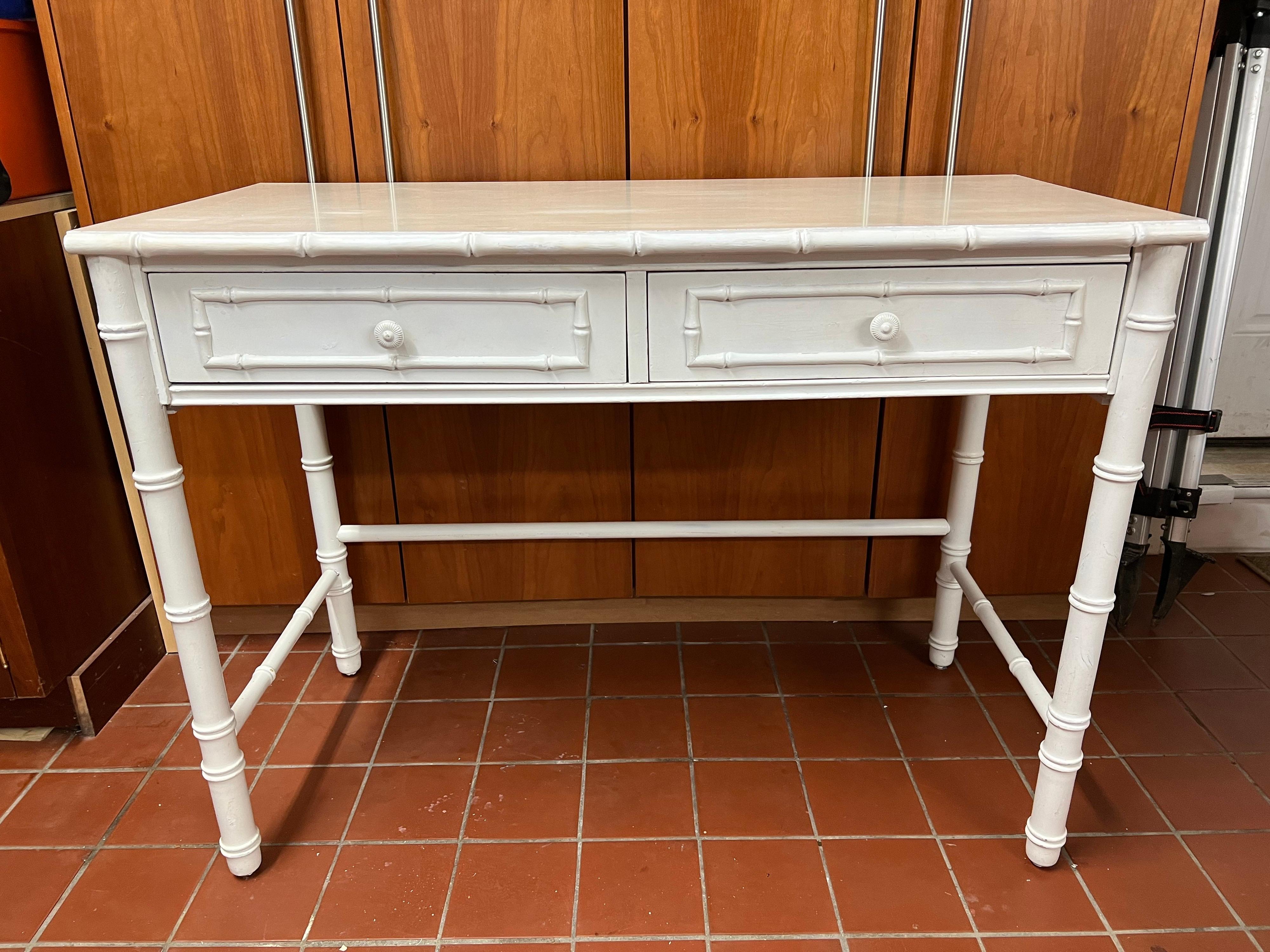Thomasville Allegro faux bamboo desk. Thomasville Allegro collection in white painted finish, laminate topped and faux bamboo accents. Perfect for the home office and can also function as a vanity table. Classic white design to compliment any