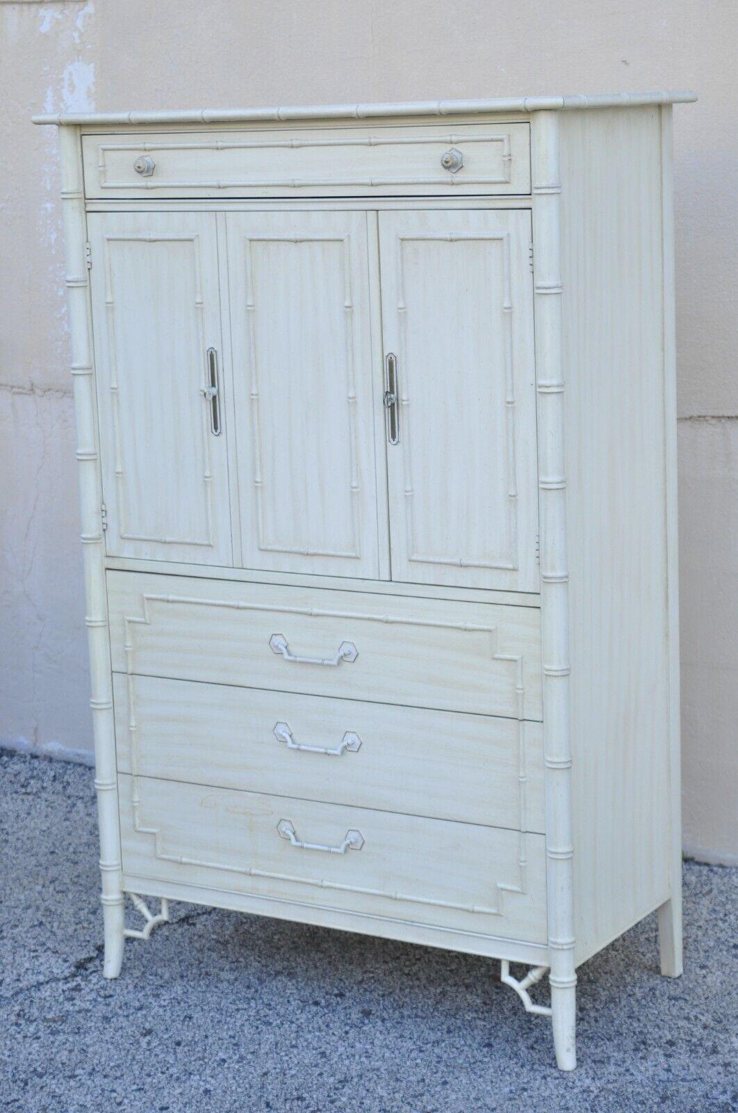 Thomasville Allegro Faux Bamboo Fretwork Highboy Tall Chest Dresser Cabinet. Item features a white laminate top, faux bamboo fretwork frame, distressed off white/beige finish, 2 swing doors, 4 drawers. Circa 1972. Measurements: 61