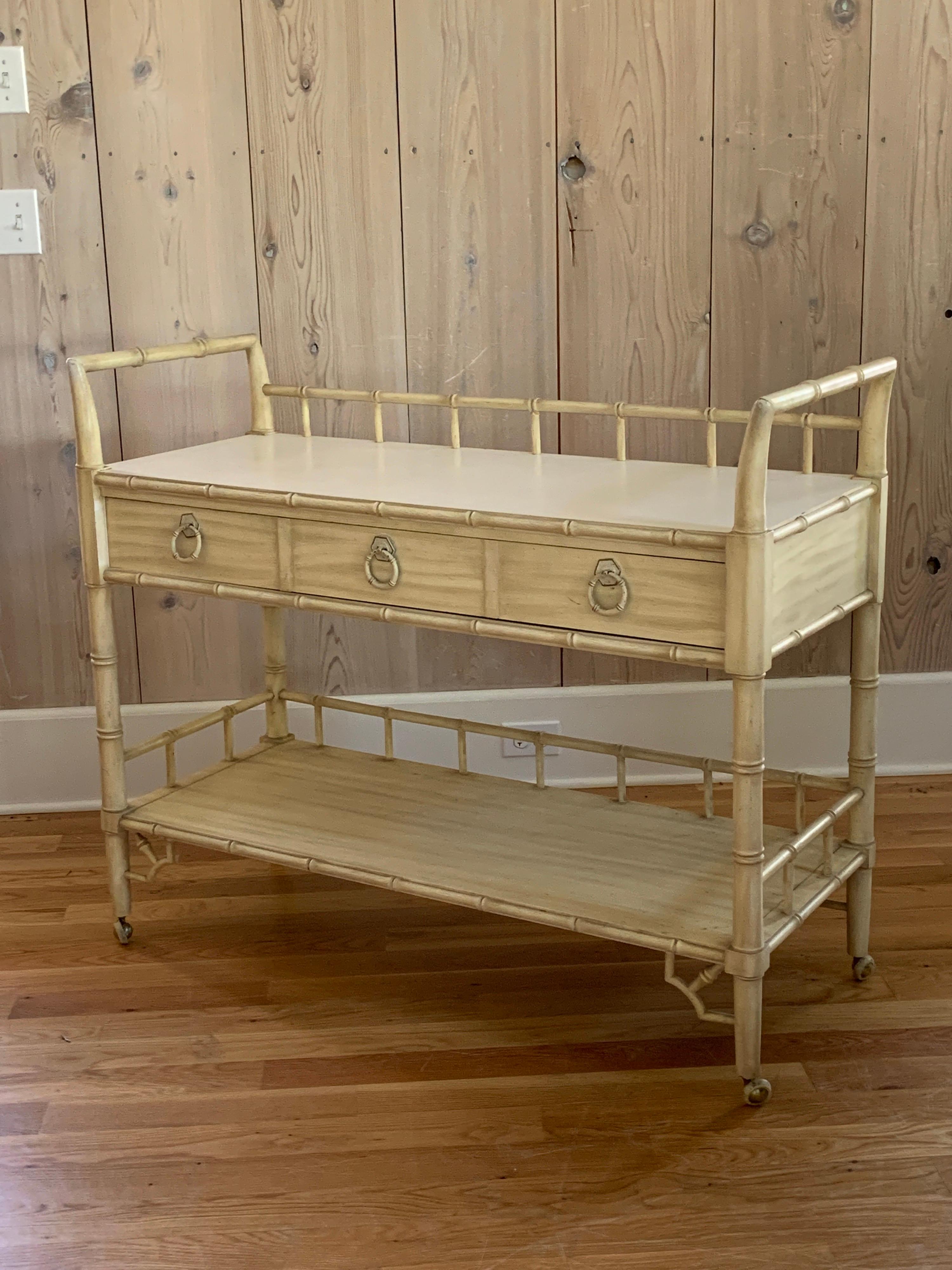 Vintage Thomasville Allegro faux bamboo serving cart in original finish. Cart measures 44.5” wide, 18” deep, and 36.5” tall.