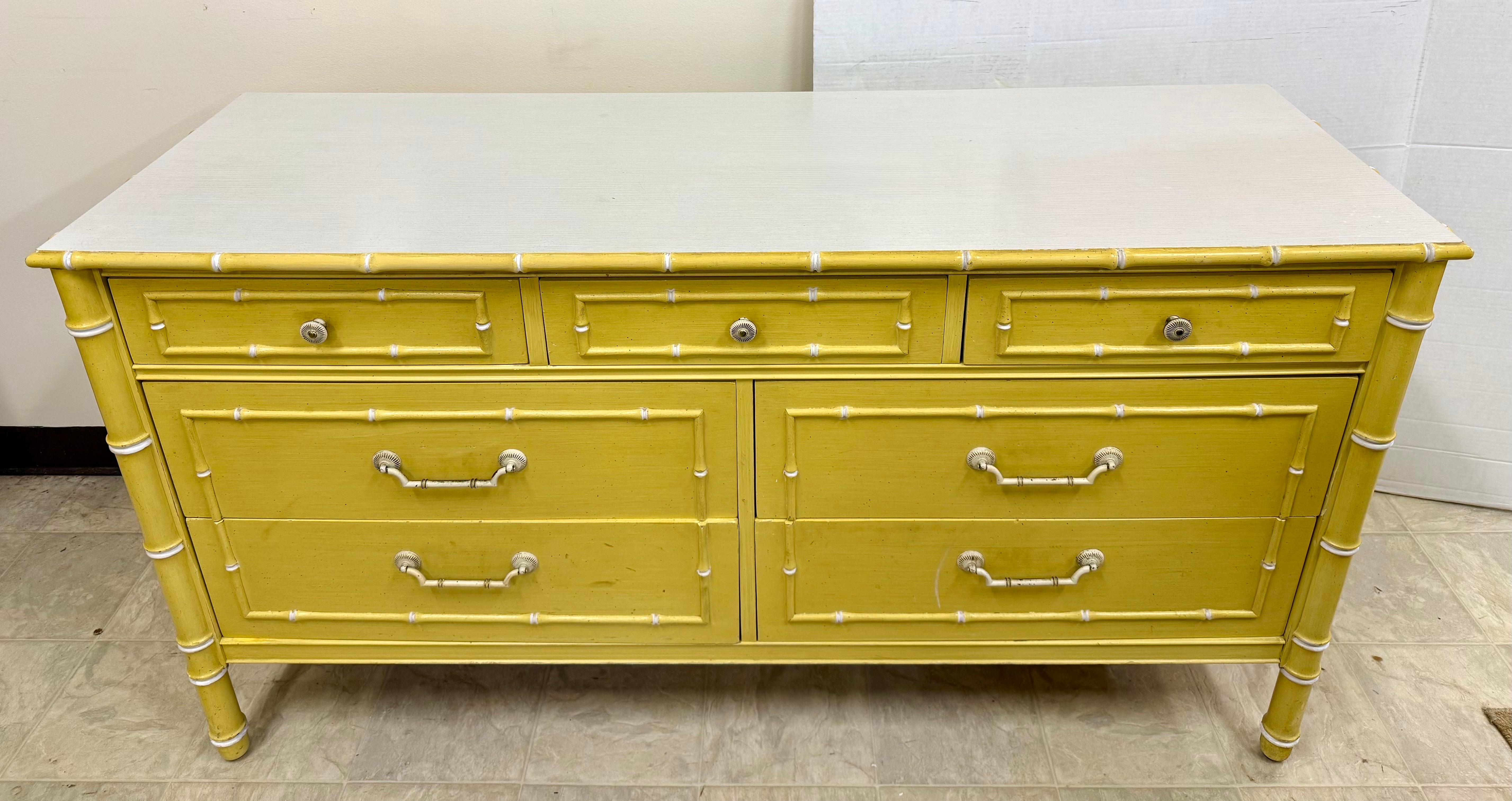 Rare and highly sought-after Thomasville Allegro dresser from 1963 is a stunning example of mid-century modern design with Chinoiserie influences. Featuring faux bamboo details and a vibrant yellow finish, this seven-drawer dresser is both