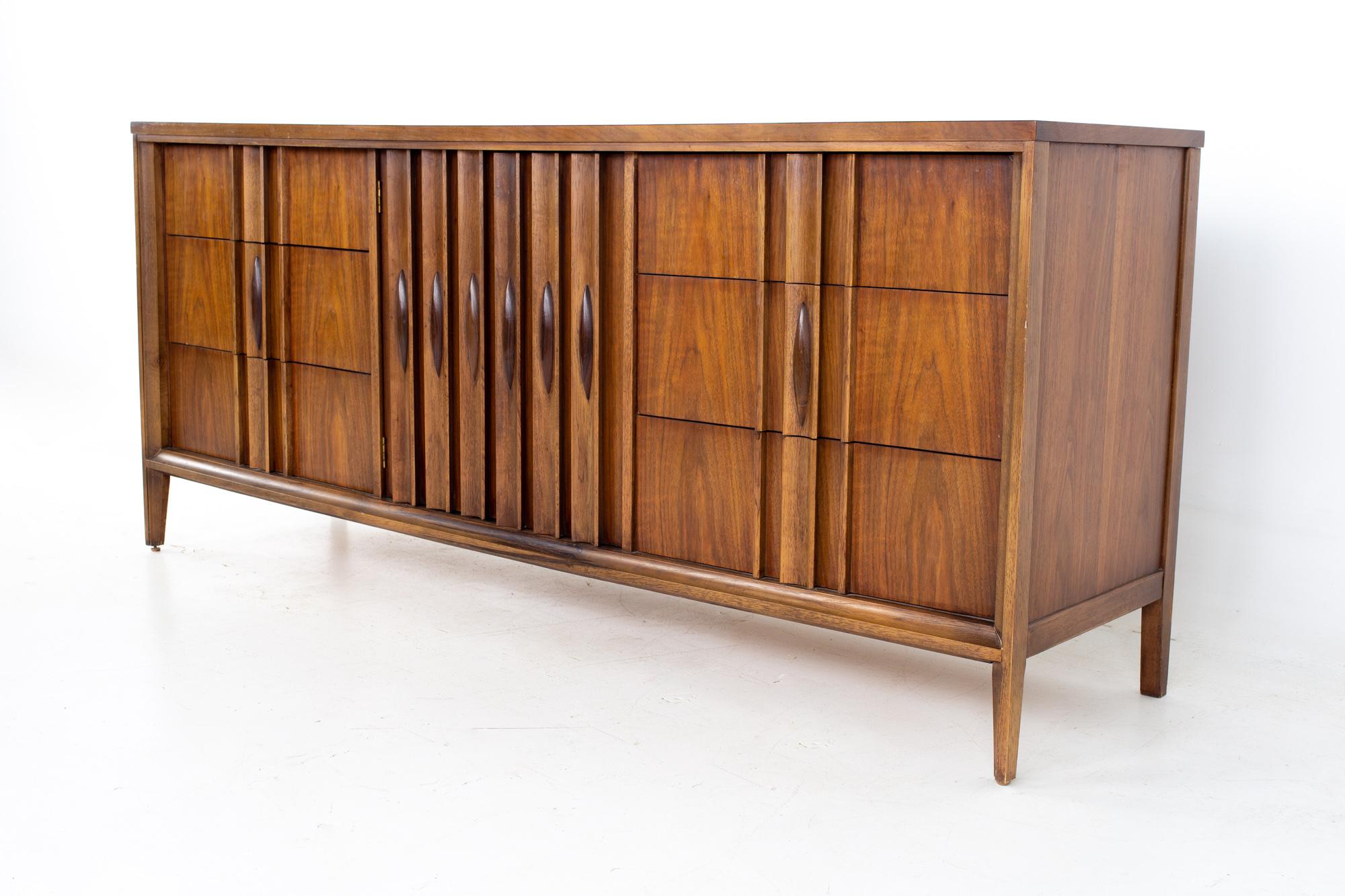 Thomasville Brutalist mid century walnut 9 drawer lowboy dresser.
Dresser measures: 74 wide x 19 deep x 32 inches high

All pieces of furniture can be had in what we call restored vintage condition. That means the piece is restored upon purchase