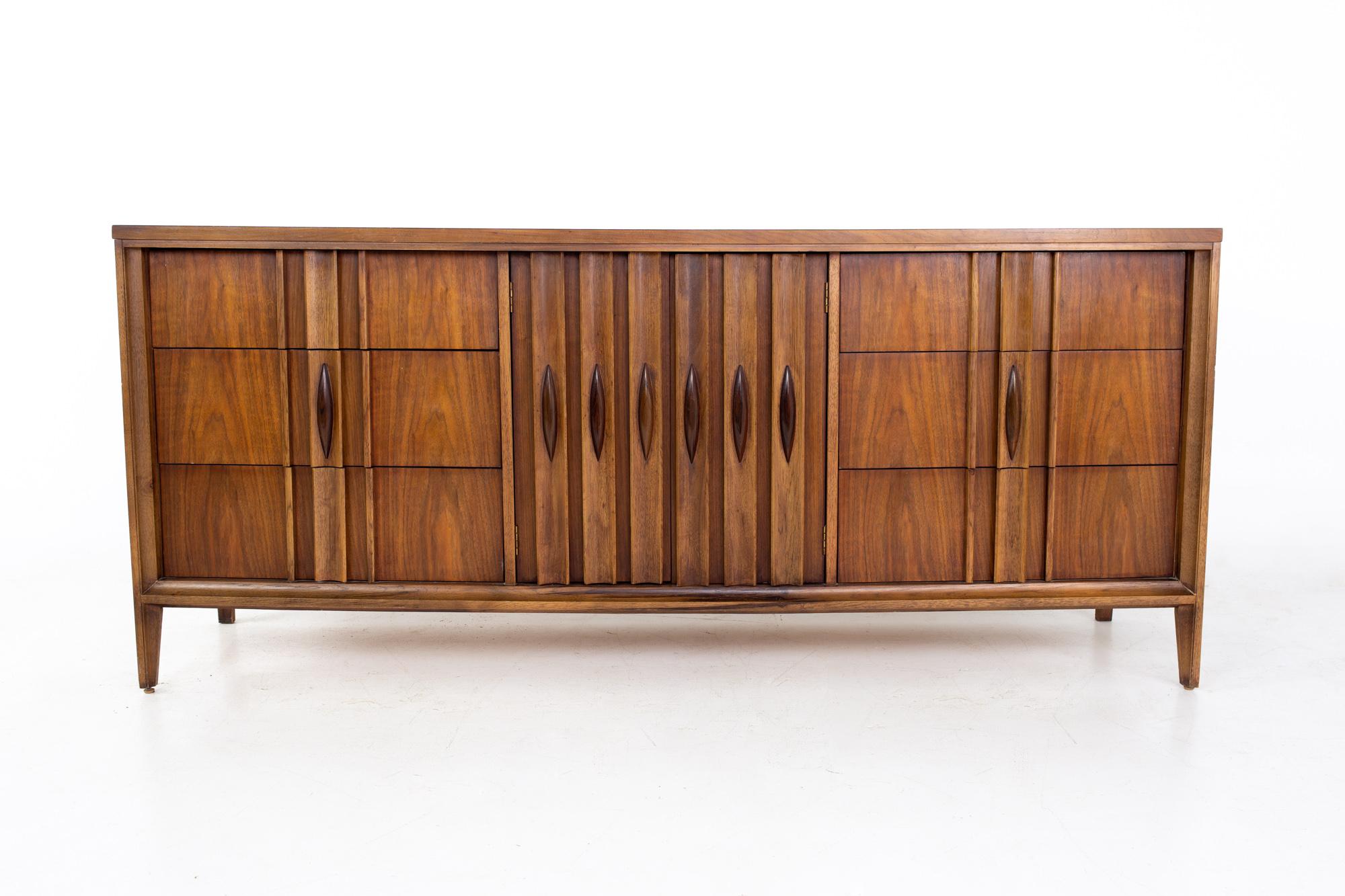 Thomasville Brutalist mid century walnut 9 drawer lowboy dresser.
Dresser measures: 74 wide x 19 deep x 32 inches high

All pieces of furniture can be had in what we call restored vintage condition. That means the piece is restored upon purchase