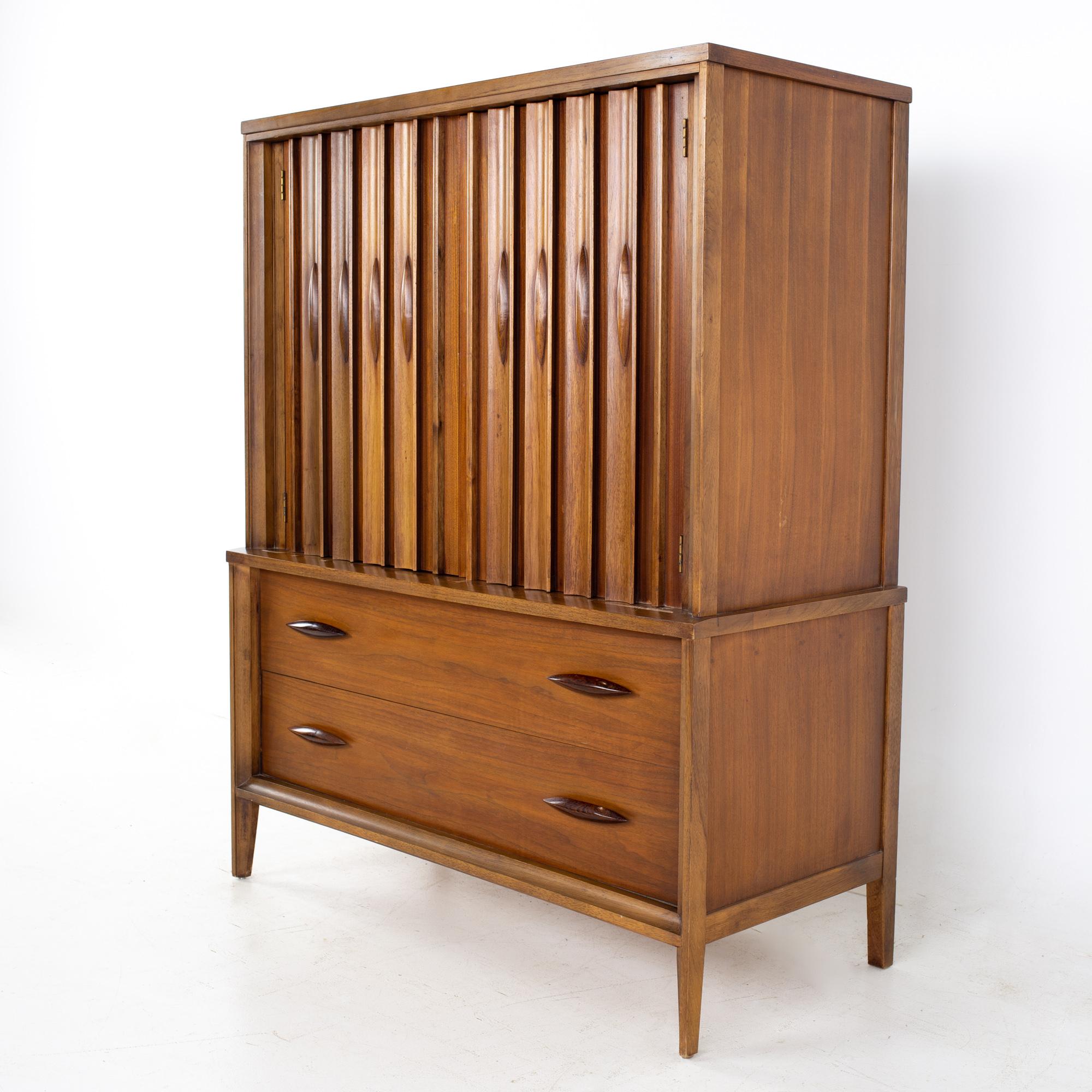 Thomasville Brutalist mid century walnut armoire gentleman's chest highboy dresser.
Dresser measures: 43 wide x 20 deep x 54 inches high

All pieces of furniture can be had in what we call restored vintage condition. That means the piece is