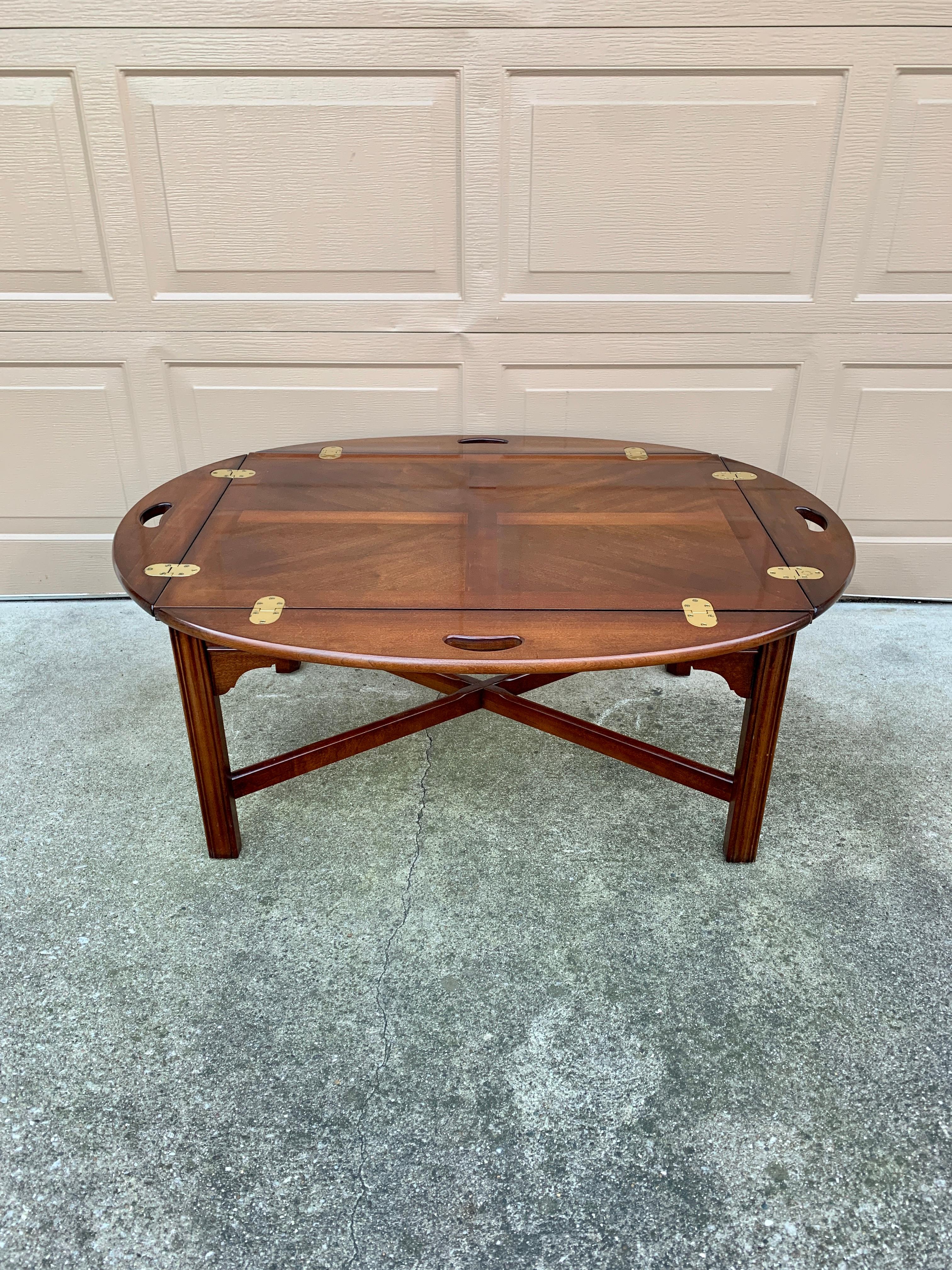 A gorgeous Chippendale or Georgian style butler’s coffee table

By Thomasville

USA, Circa 1980s

Beautiful carved mahogany, with brass hinges.

Measures: 43″W x 33″D x 17.25″H.

Very good original vintage condition.
