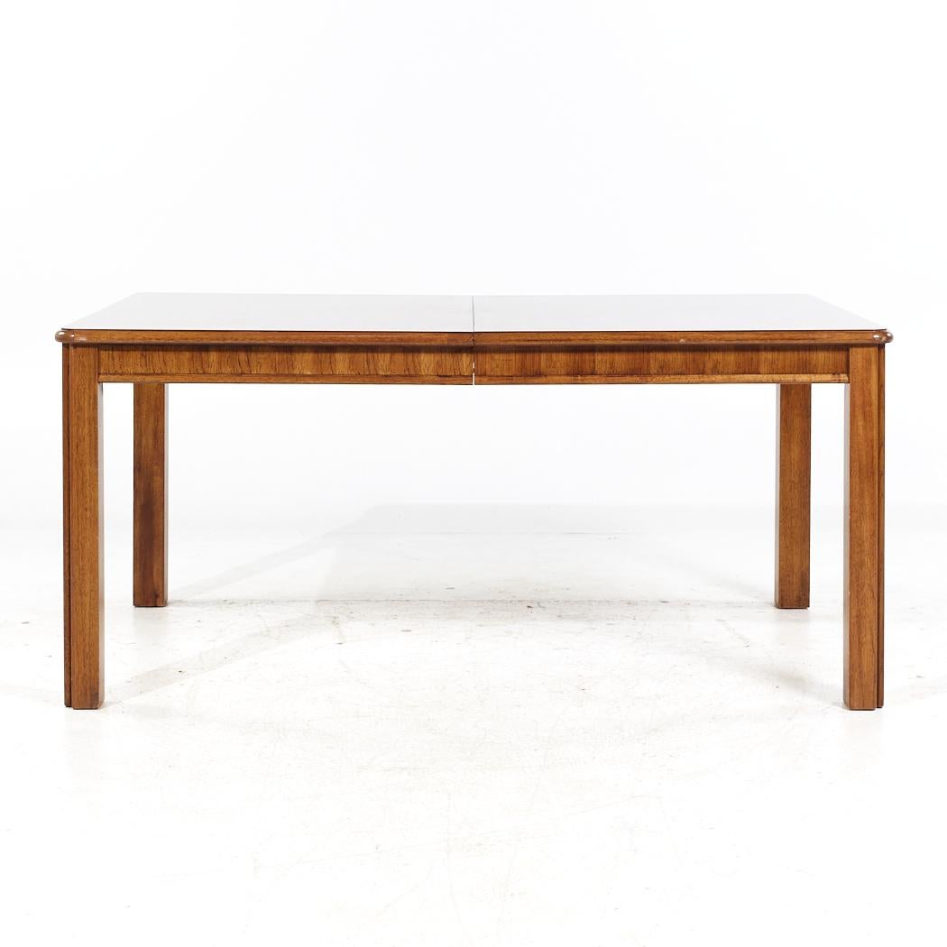 Thomasville Contemporary Walnut Expanding Dining Table with 2 Leaves

This table measures: 64.5 wide x 41.5 deep x 29.5 inches high, with a chair clearance of 25.25 inches, each leaf measures 18 inches wide, making a maximum table width of 96.5