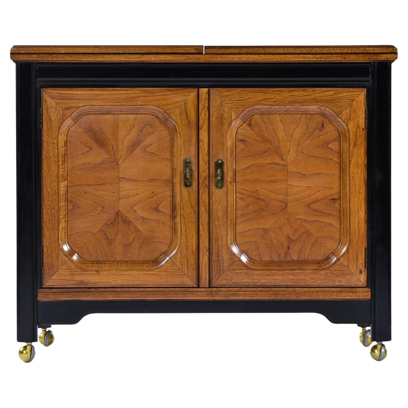 Dorothy Draper style campaign server bar cart on casters made by esteemed US furniture maker Thomasville circa 1970s. Old growth flaxen flared grain fruitwood (most likely pecan) from top to bottom, front and back. Beautifully finished on all four
