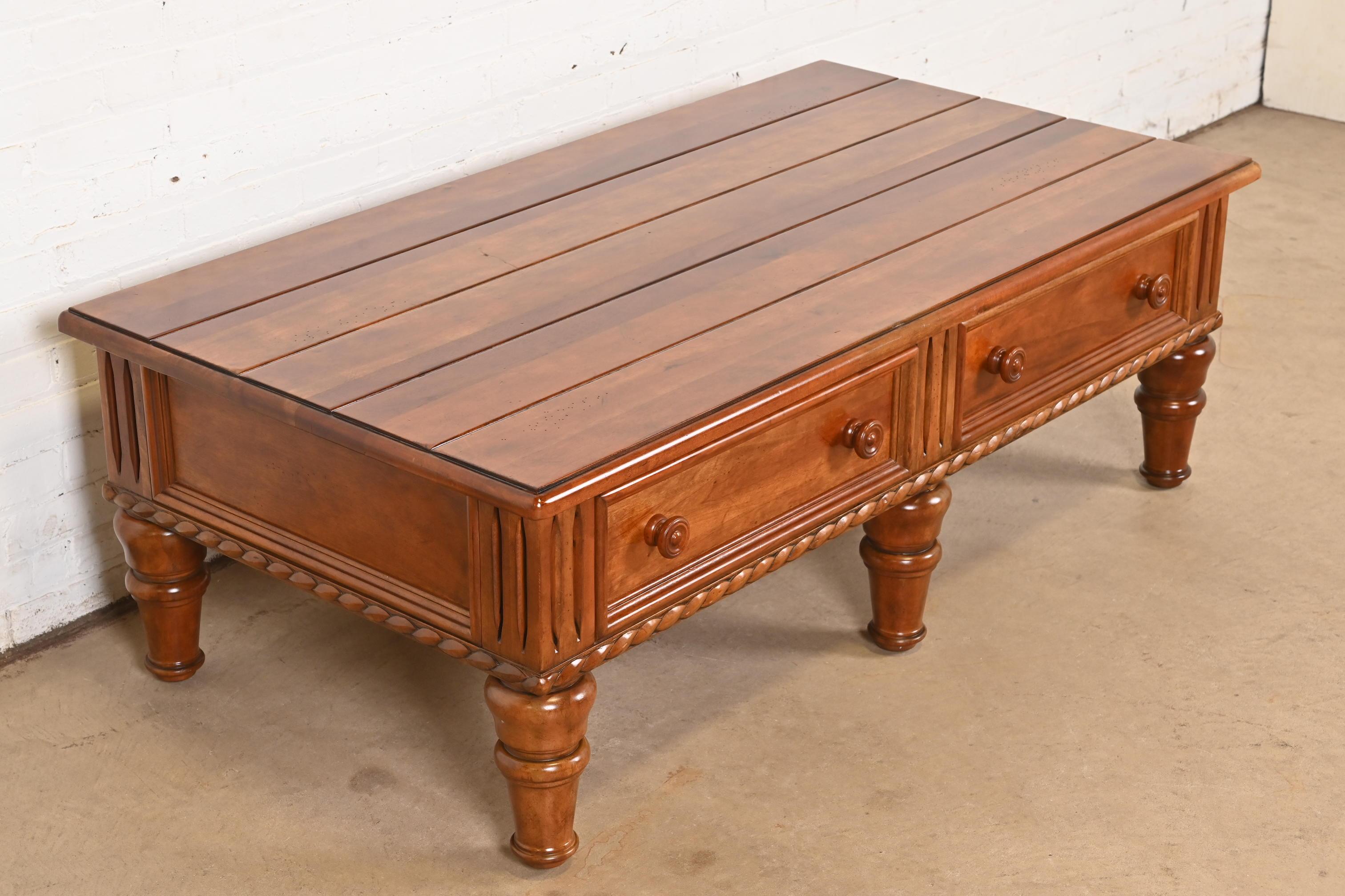 A gorgeous Rustic European style carved maple coffee table or cocktail table with drawers on each side

By Thomasville, 