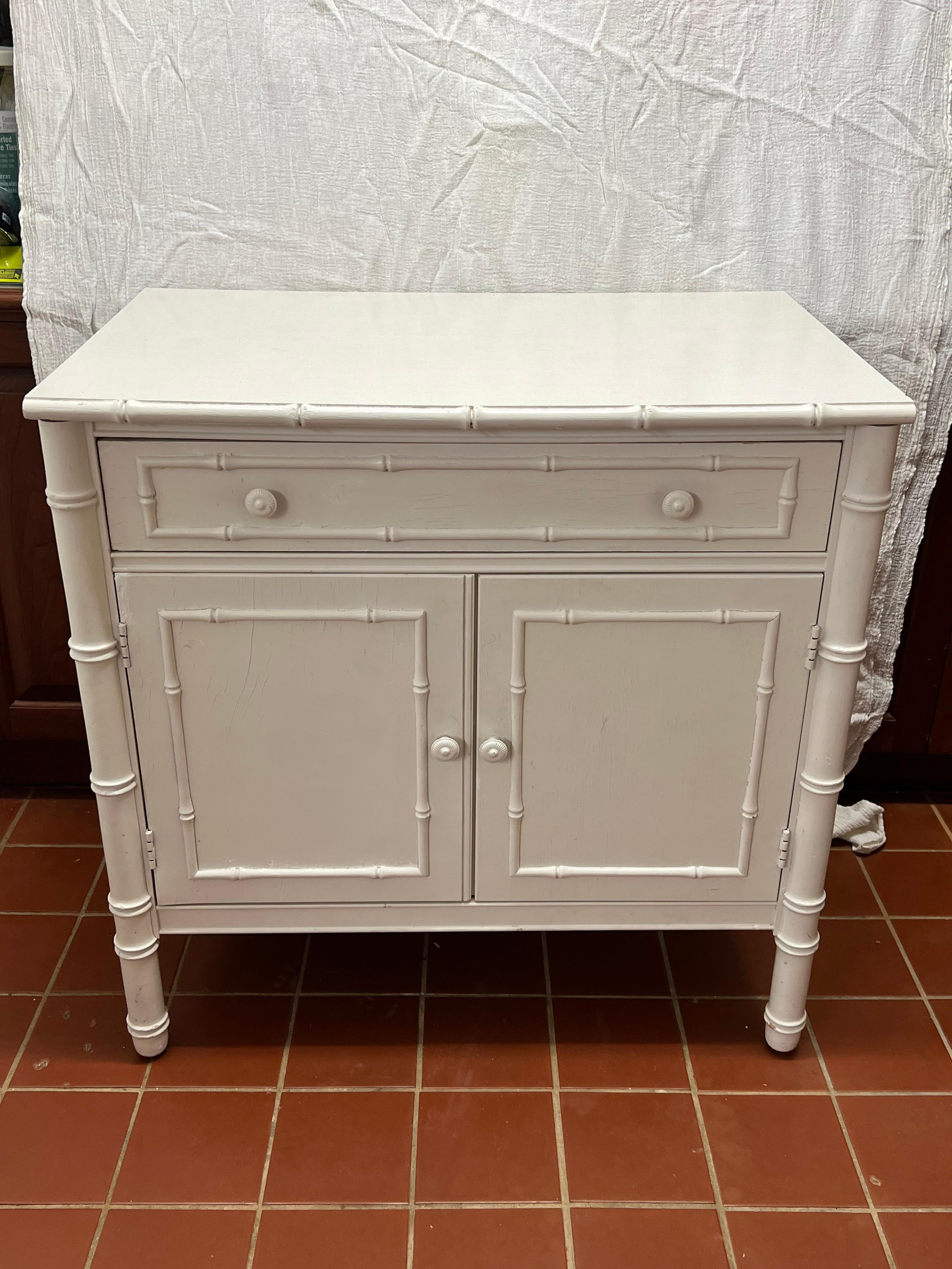 Thomasville Allegro faux bamboo Cabinet. Thomasville Allegro collection in white painted finish, laminate topped and faux bamboo accents. Classic white design to compliment any interior.