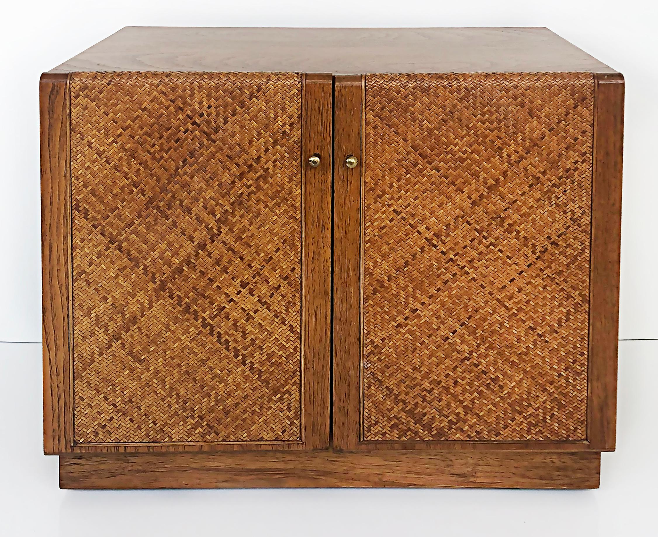 Thomasville Founders Woven Cane 2-door oak nightstand with brass pulls 

Offered for sale is a Thomasville Founders oak two-door cabinet with woven cane doors, brass door pulls, and open shelves. This nightstand matches a dresser we have available