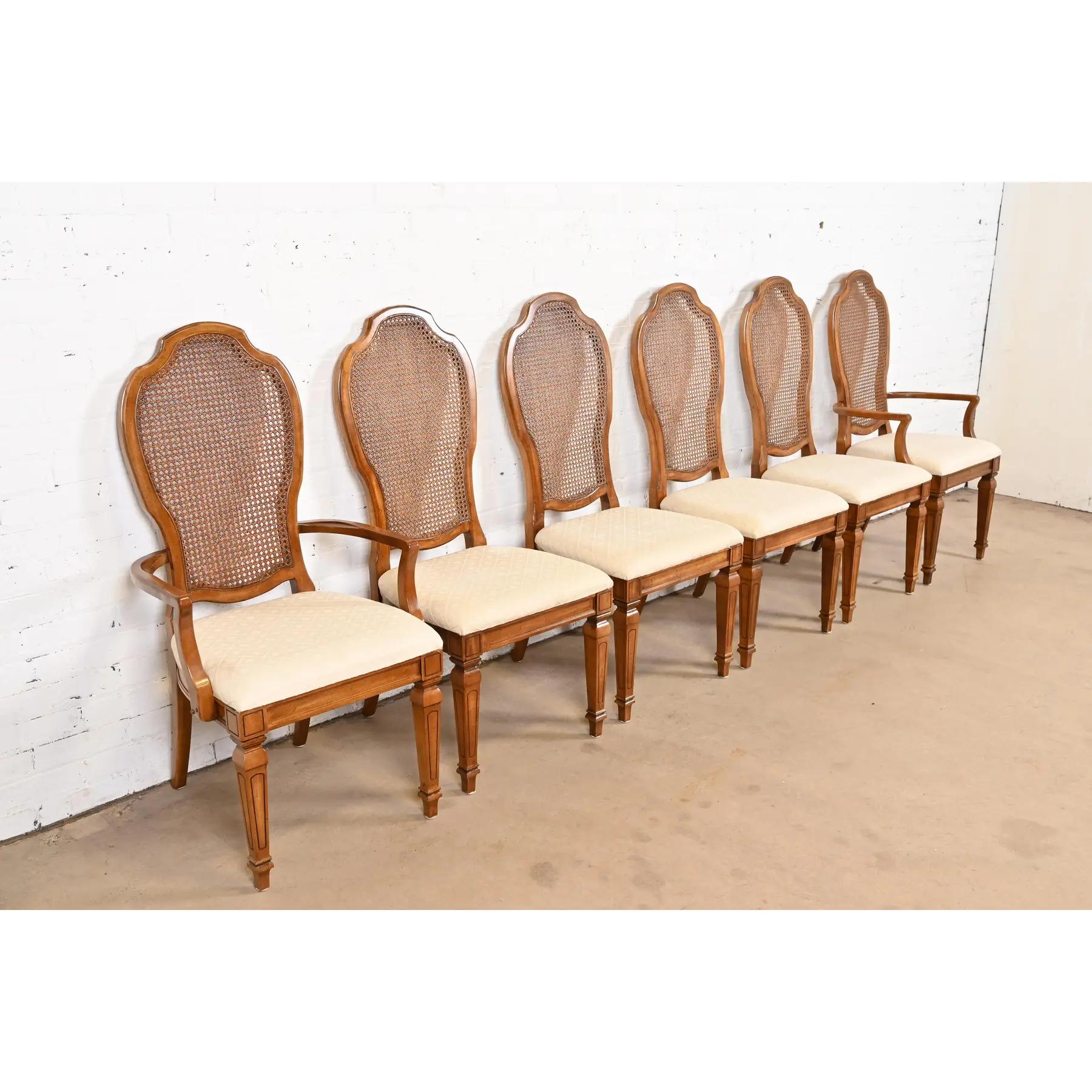 Mid-20th Century Thomasville French Regency Louis XVI Carved Cherry Wood Cane Back Dining Chairs For Sale