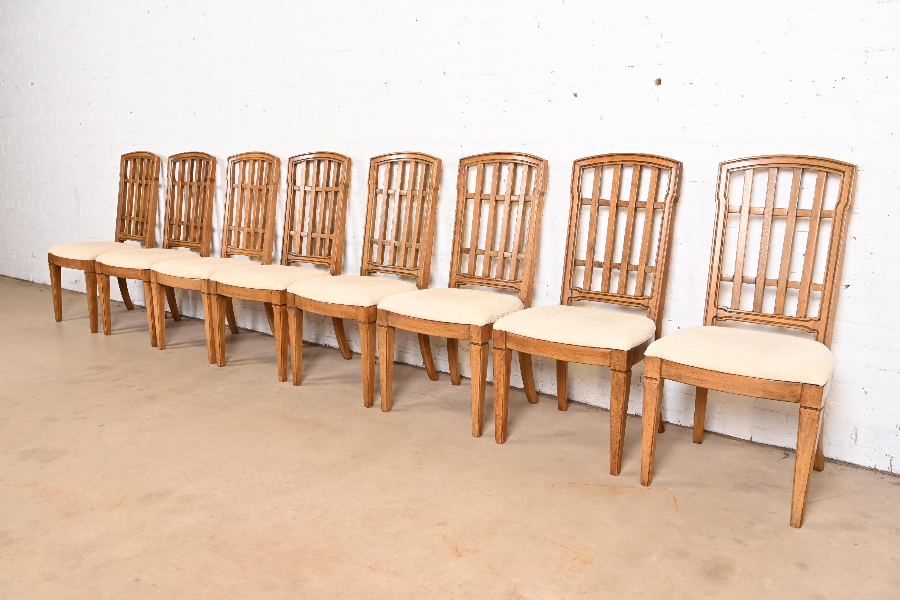 A gorgeous set of eight mid-century French Regency Louis XVI style dining chairs

By Thomasville

USA, Circa 1960s

Sculpted walnut frames, with upholstered seats.

Measures: 19.25