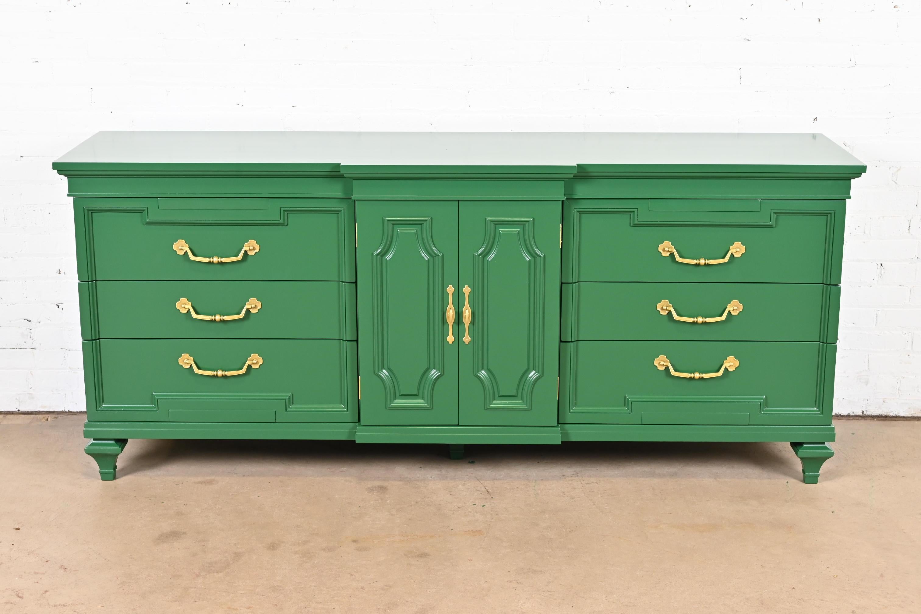 A gorgeous French Regency Louis XVI or Hollywood Regency style dresser or credenza

By Thomasville

USA, Circa 1960s

Green lacquered carved walnut, with original brass hardware.

Measures: 78.25 x 21