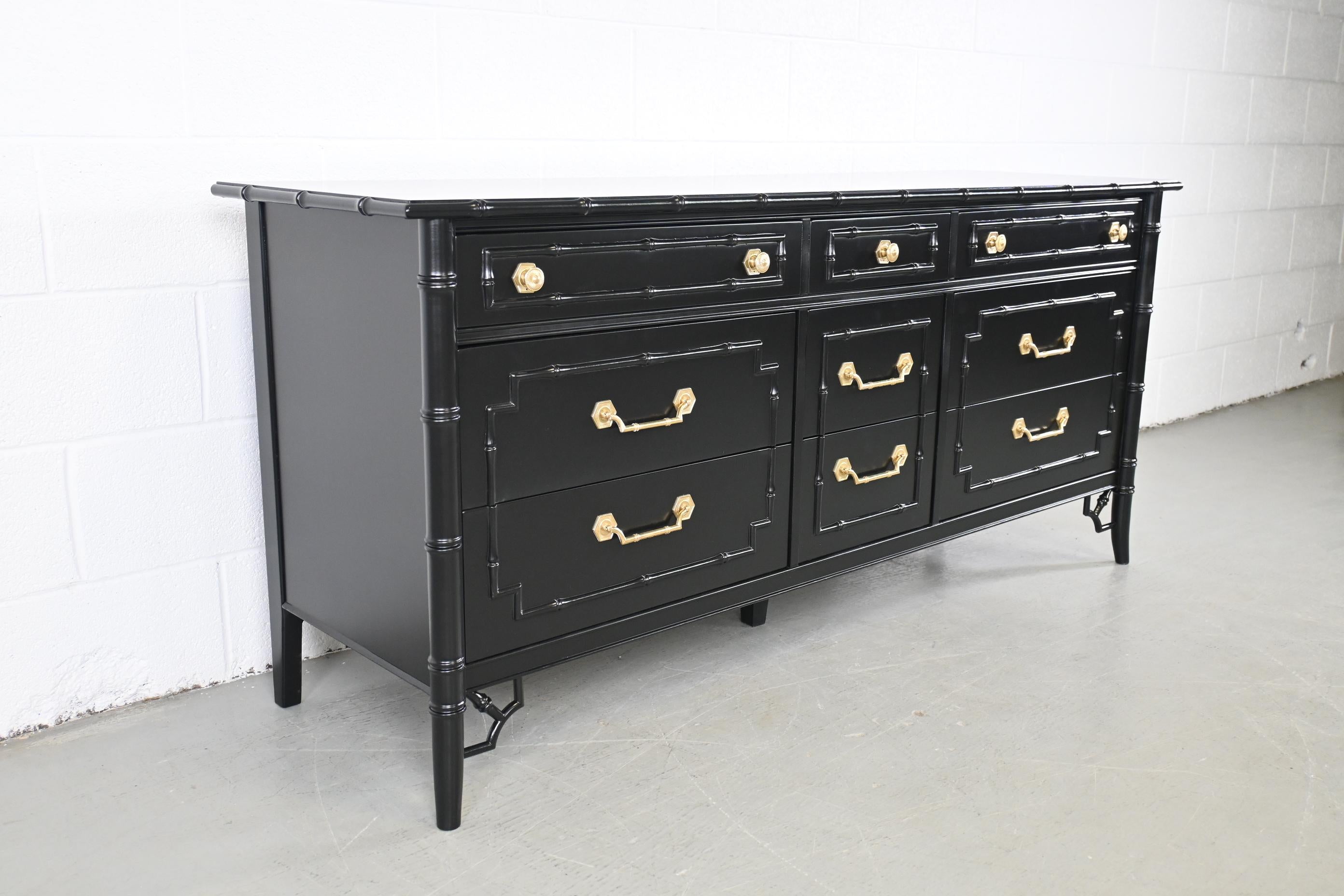 black dresser with brass hardware