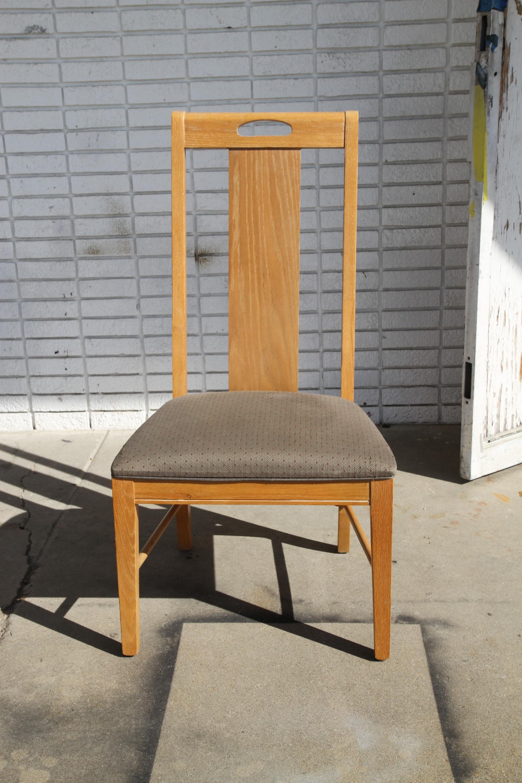 This is a nice set of Oak Dining chairs by Thomasville Furniture. The set consist of 6 side chairs constructed of oak with high back and a nice upholstered fabric. They have straight lines and would make a nice addition to any dining room table.