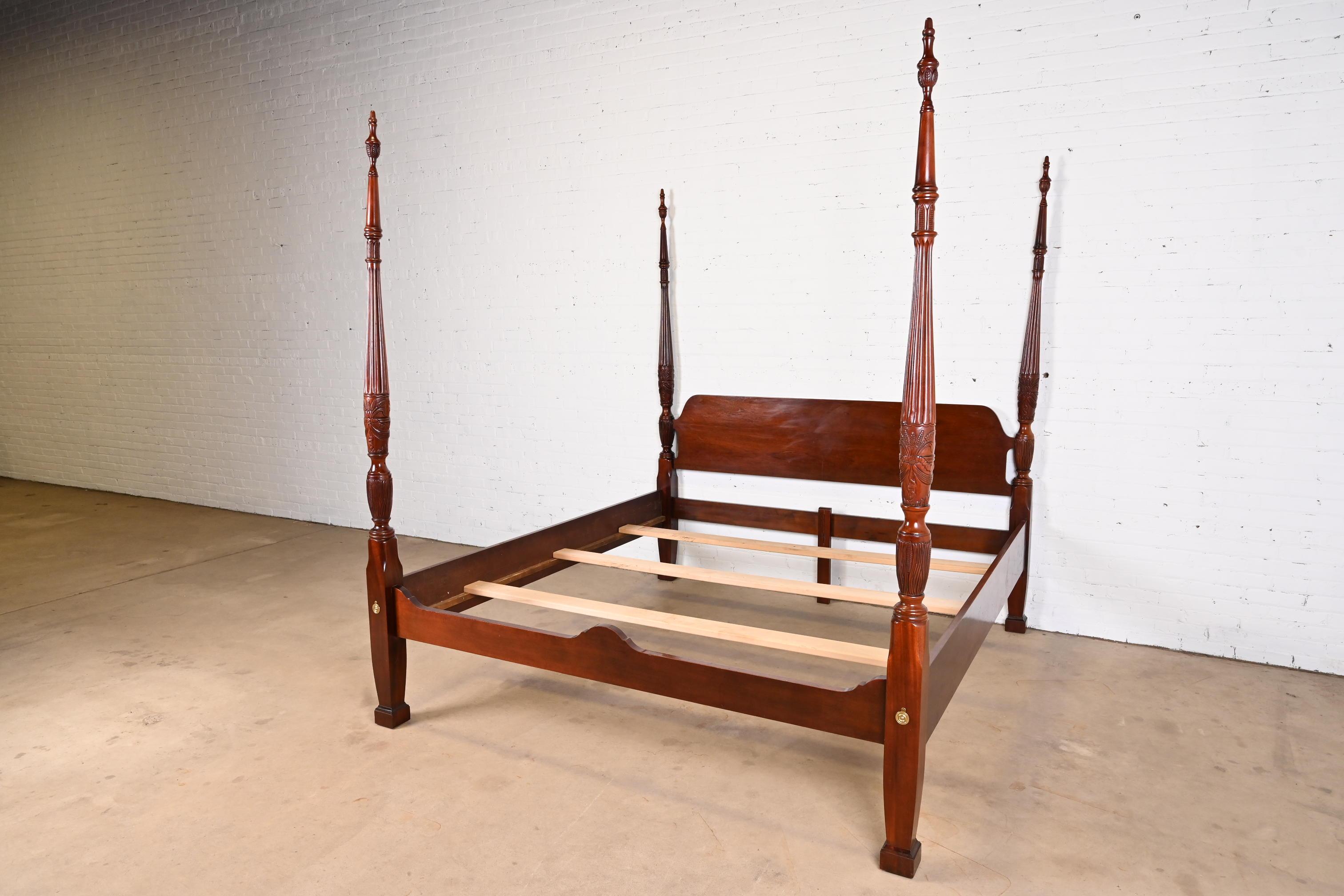 A gorgeous Georgian or Chippendale style four poster king size rice bed

By Thomasville

USA, Circa 1980s

Carved solid mahogany, with brass accents.

Measures: 79.25