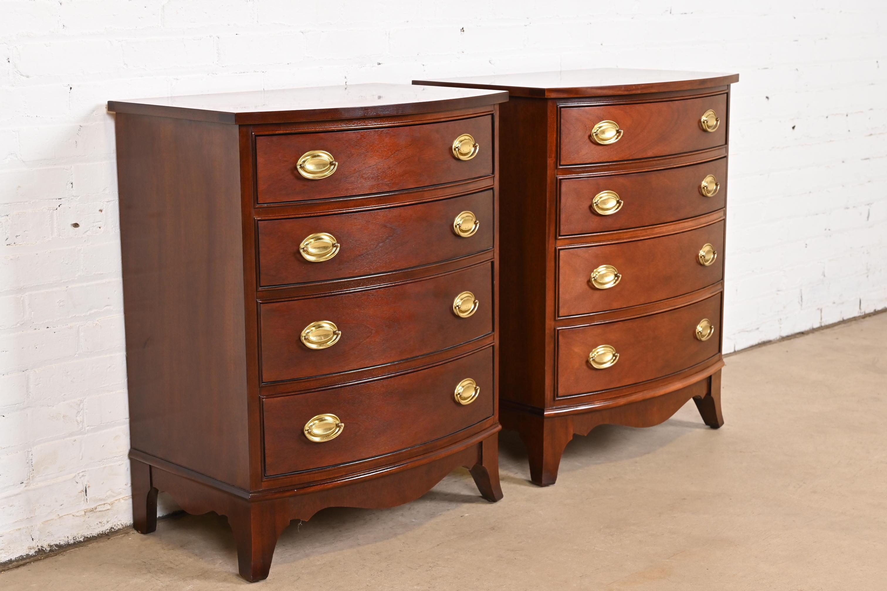 A beautiful pair of Georgian or Federal style four-drawer bow front bachelor chests or nightstands

By Thomasville

USA, Circa 1980s

Carved mahogany, with original brass hardware.

Each measures: 24.88