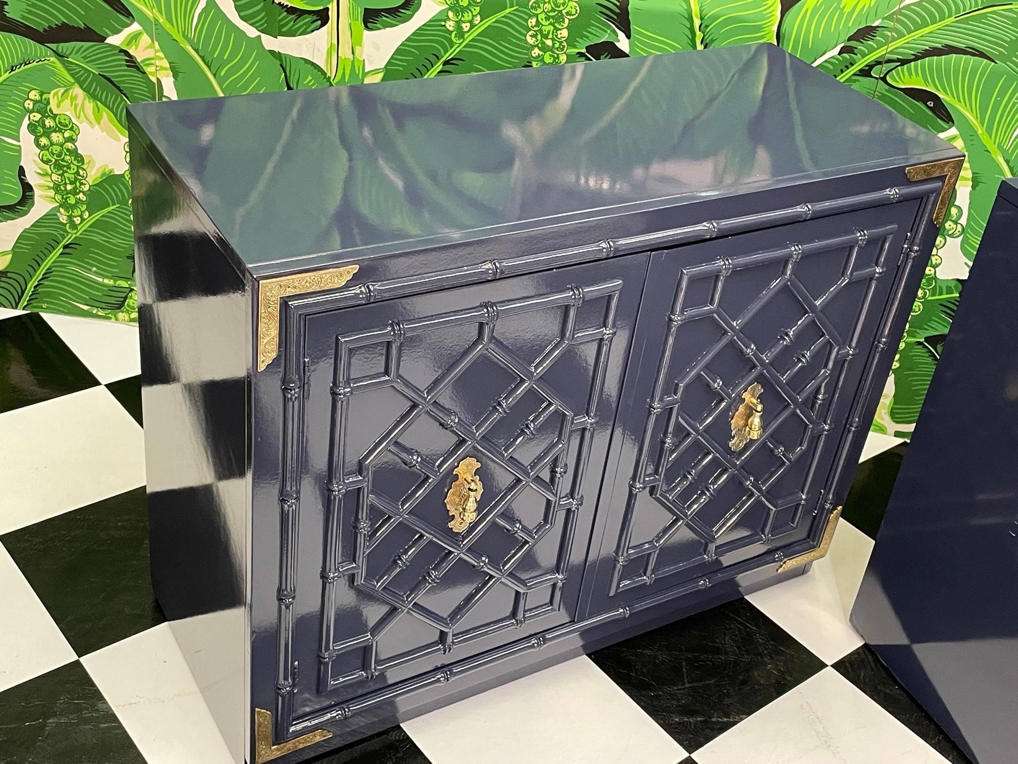 Faux bamboo cabinets feature brass hardware and detailing and a high gloss lacquer. Doors reveal storage space with large drawer. Good condition with minor imperfections to the newly lacquered finish, see photos for condition details.
For a shipping