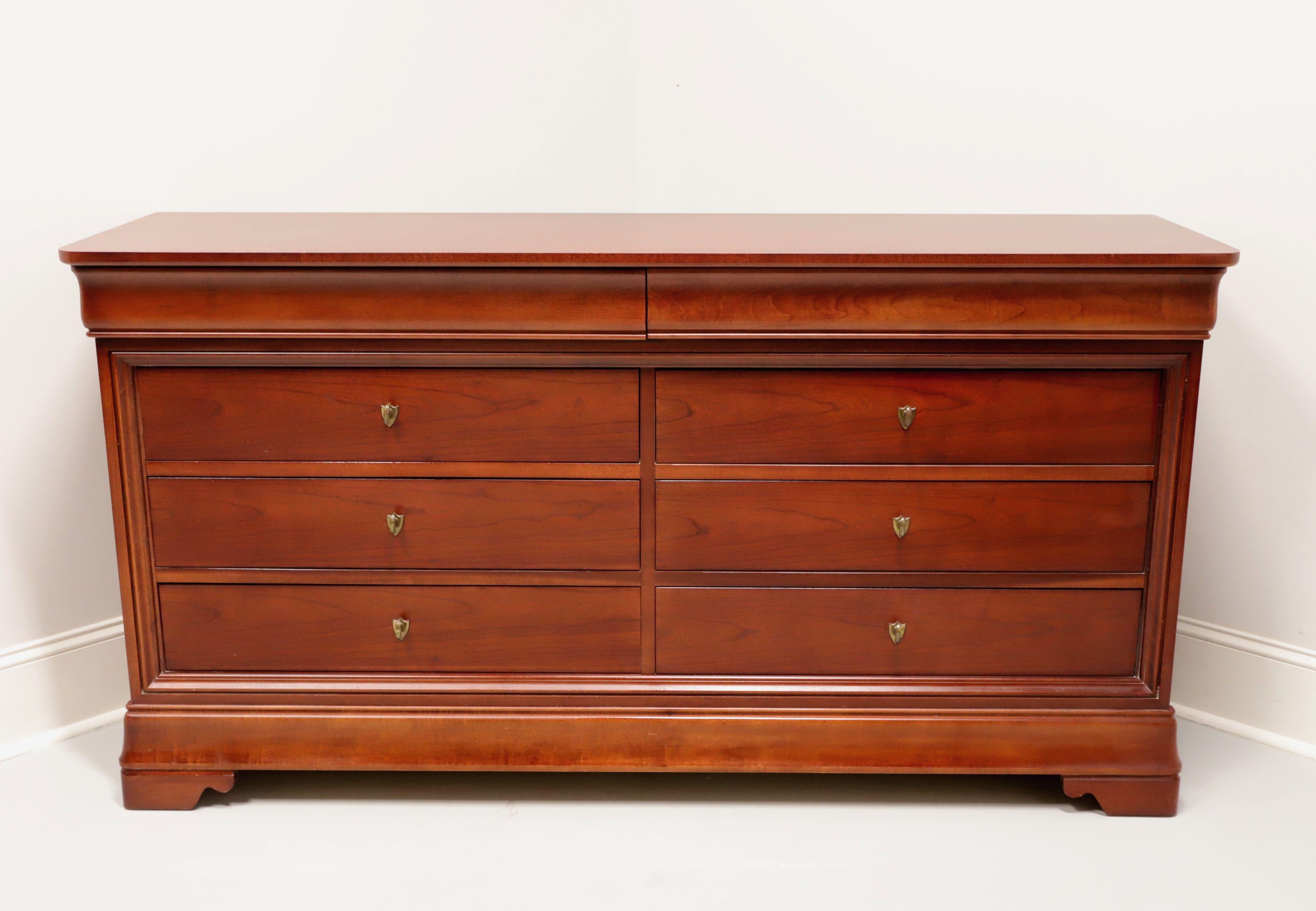 A French Louis Philippe style double dresser by Thomasville, from their Impressions Martinique Collection. Cherry wood with their Merlot finish, brass hardware, rounded corners to top and bracket feet. Features eight drawers of dovetail