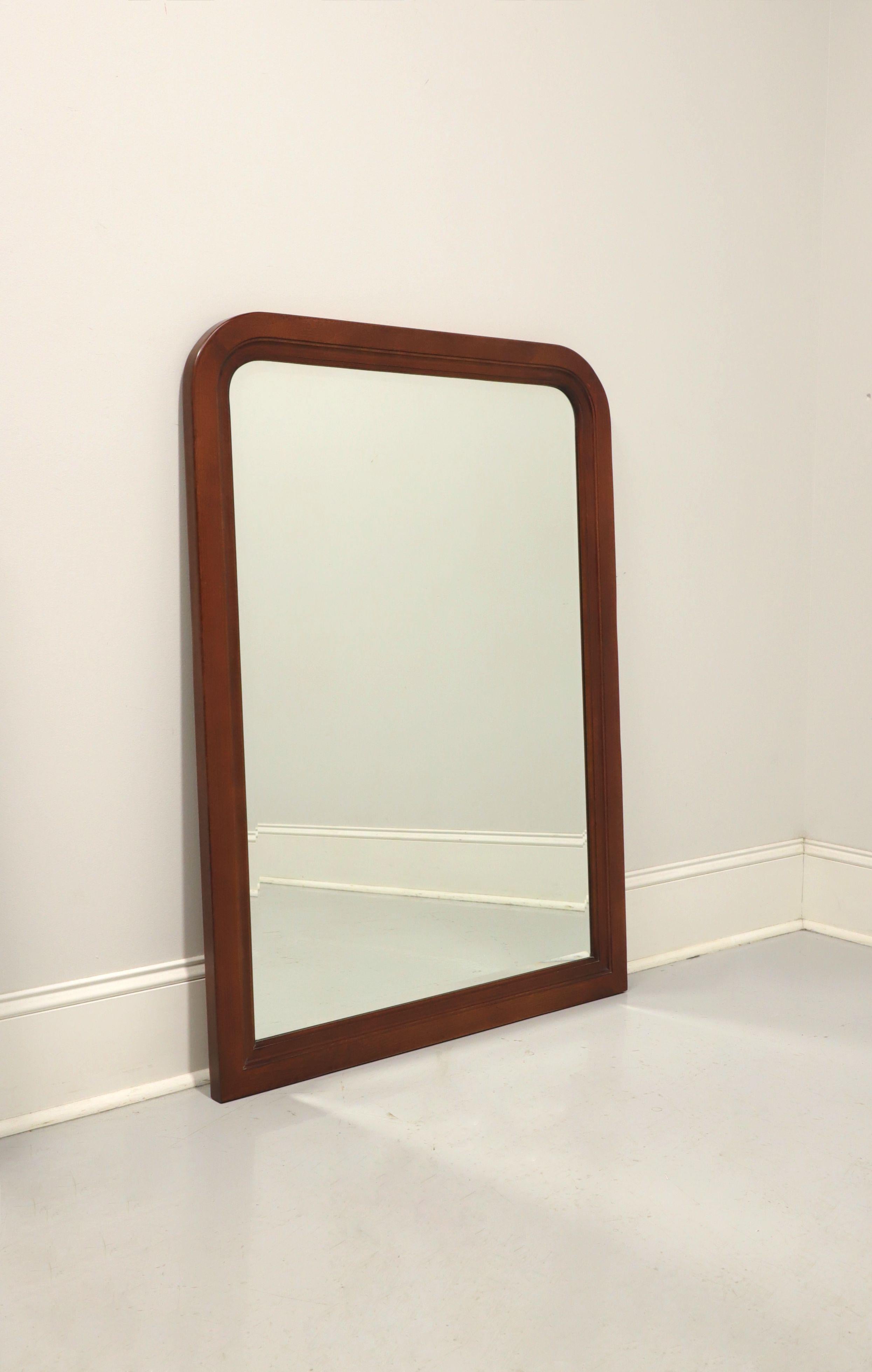 A French Louis Philippe style dresser or wall mirror by Thomasville, from their Impressions Martinique Collection. Beveled mirror glass with a cherry frame and their Merlot finish. Made in Thomasville, North Carolina, USA, in the late 20th Century.