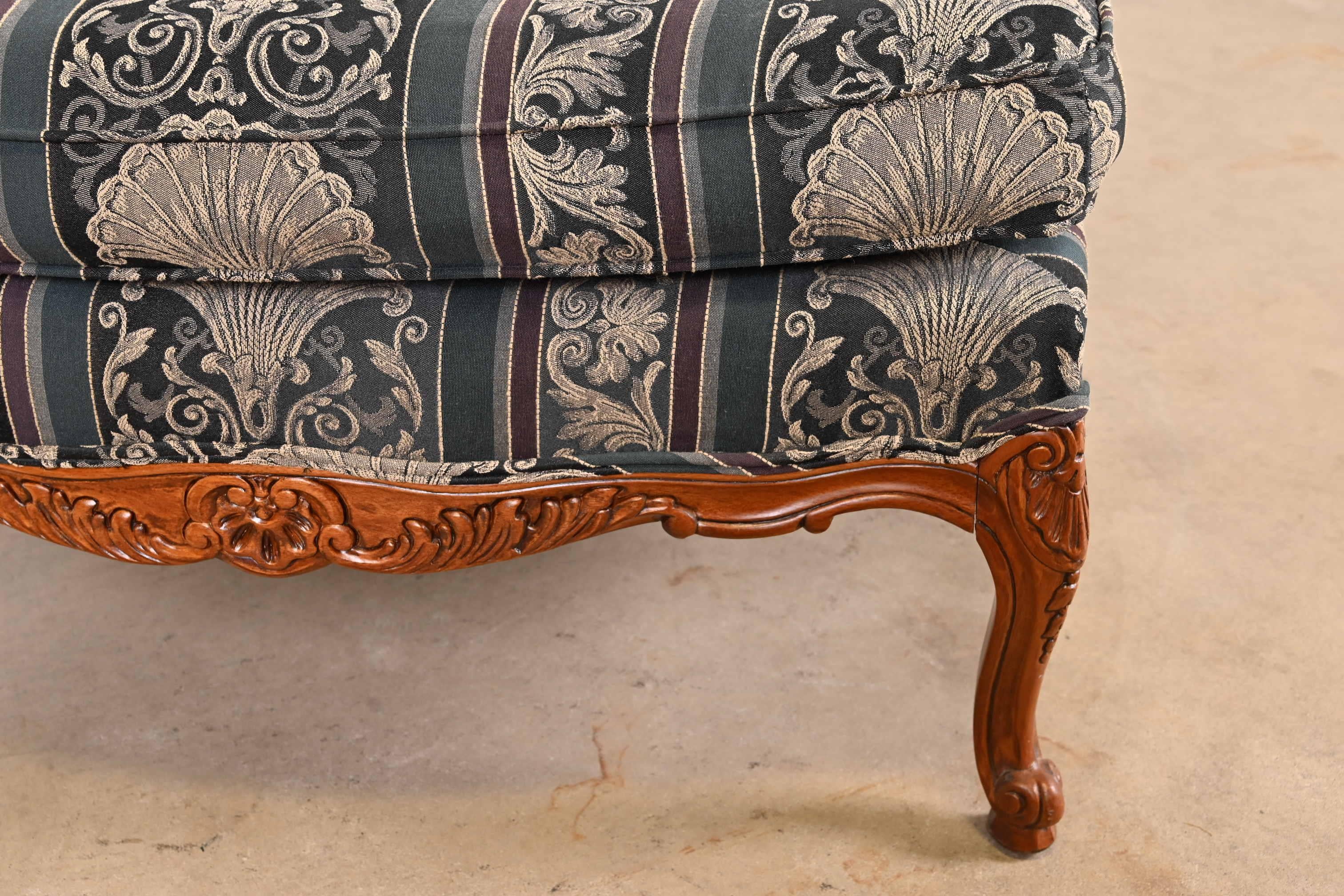 Upholstery Thomasville Louis XV Carved Walnut Upholstered Fauteuil and Ottoman For Sale