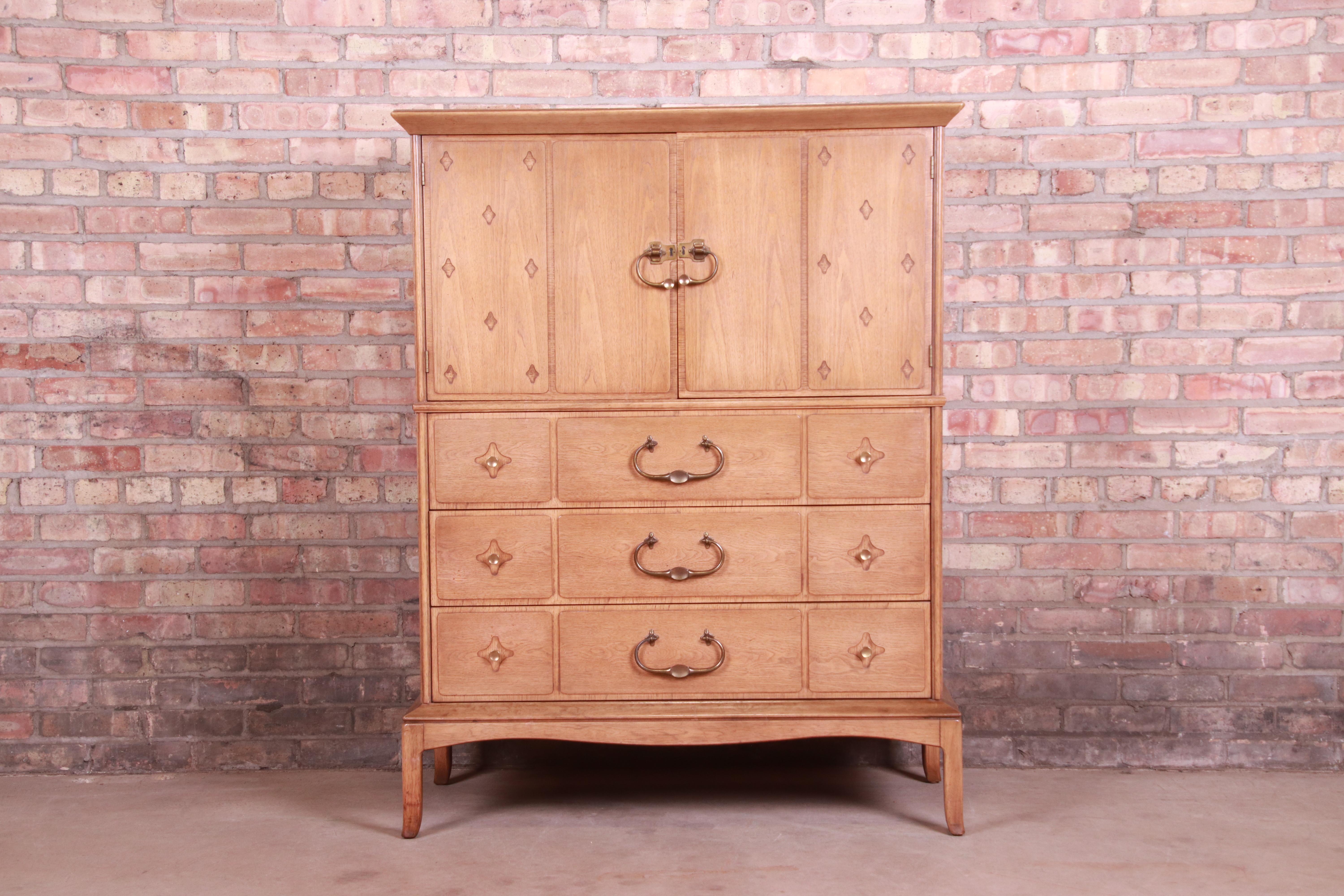 A gorgeous Mid-Century Modern Hollywood Regency gentleman's chest or highboy dresser

By Thomasville, 