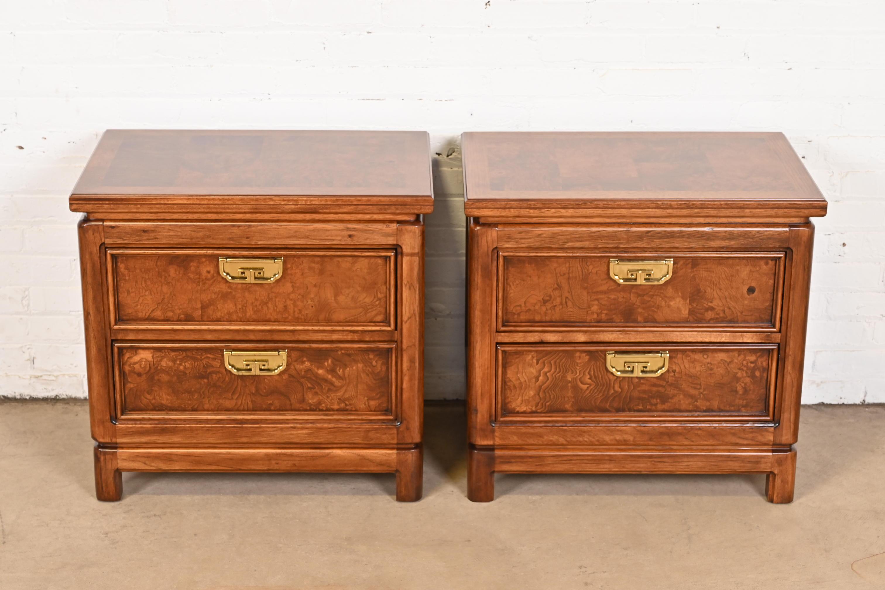 An exceptional pair of Mid-Century Modern Hollywood Regency Chinoiserie nightstands

By Thomasville

USA, Circa 1970s

Gorgeous carved oak cases, with burl wood drawer fronts, patchwork burl wood tops, and original brass hardware

Measures: 26