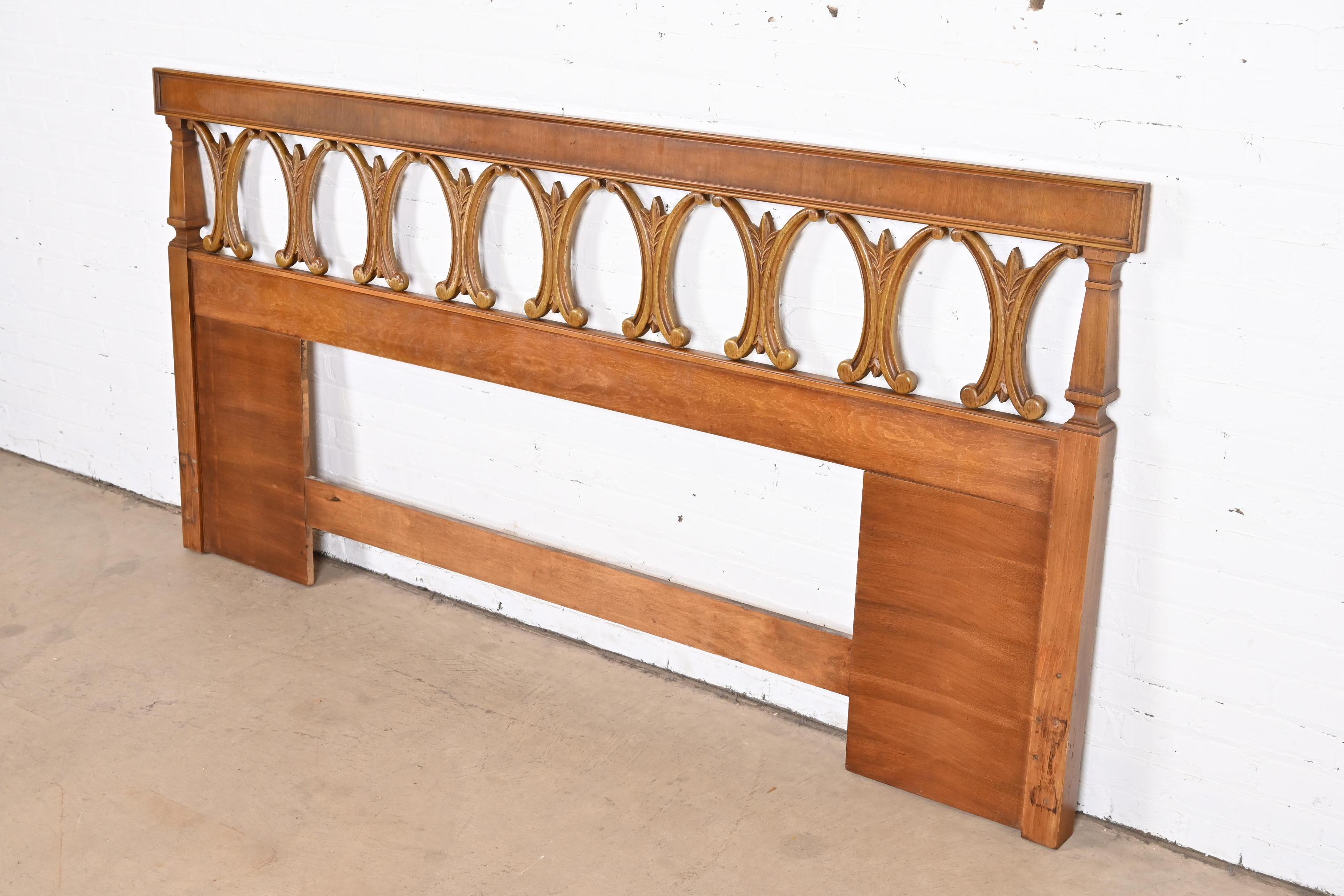 A gorgeous Mid-Century Modern Hollywood Regency sculpted walnut king size headboard.

By Thomasville.

USA, 1965.

Measures: 81.25