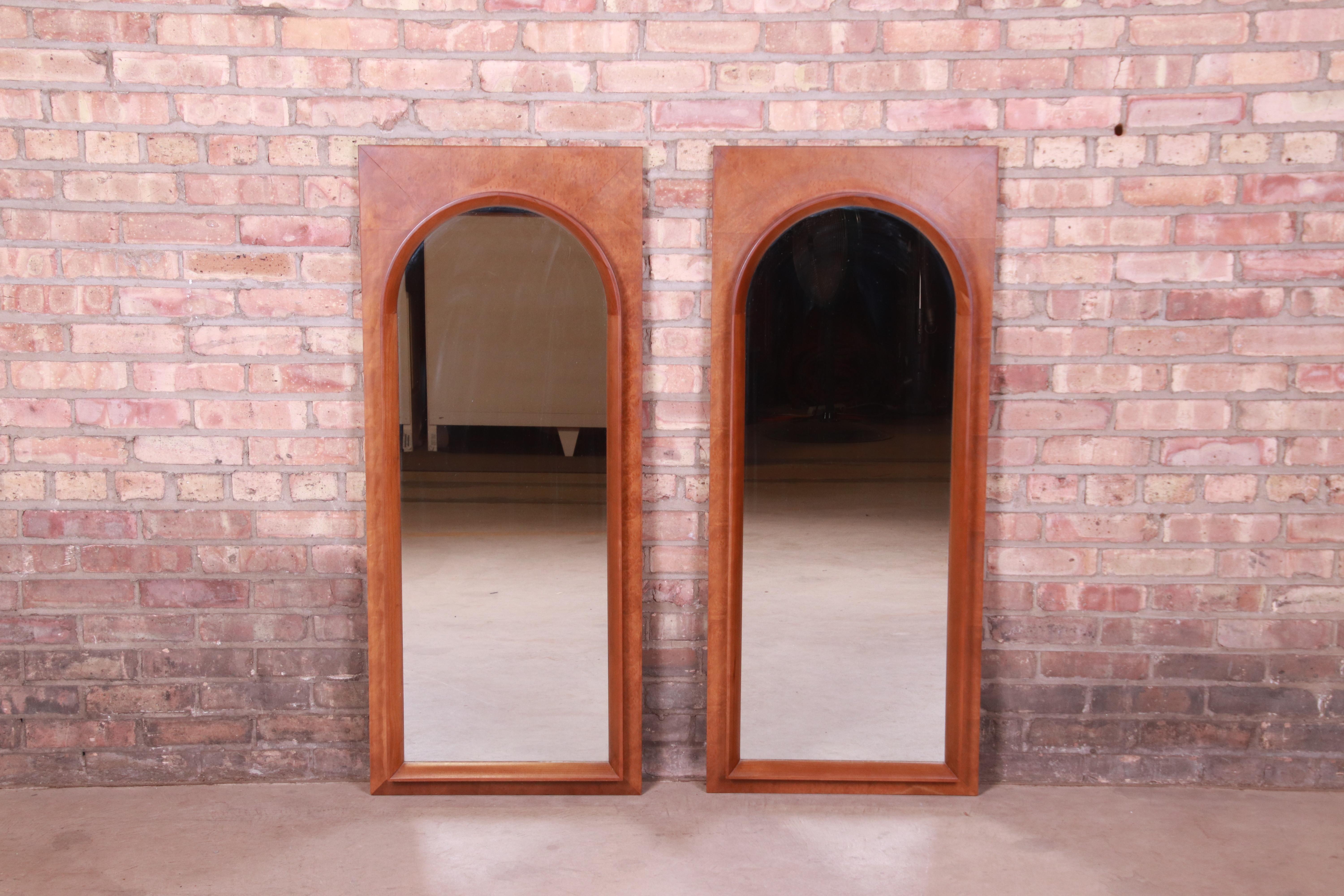 A beautiful pair of Mid-Century Modern burled walnut framed arched mirrors

By Thomasville

USA, 1960s

Measures: 20.25