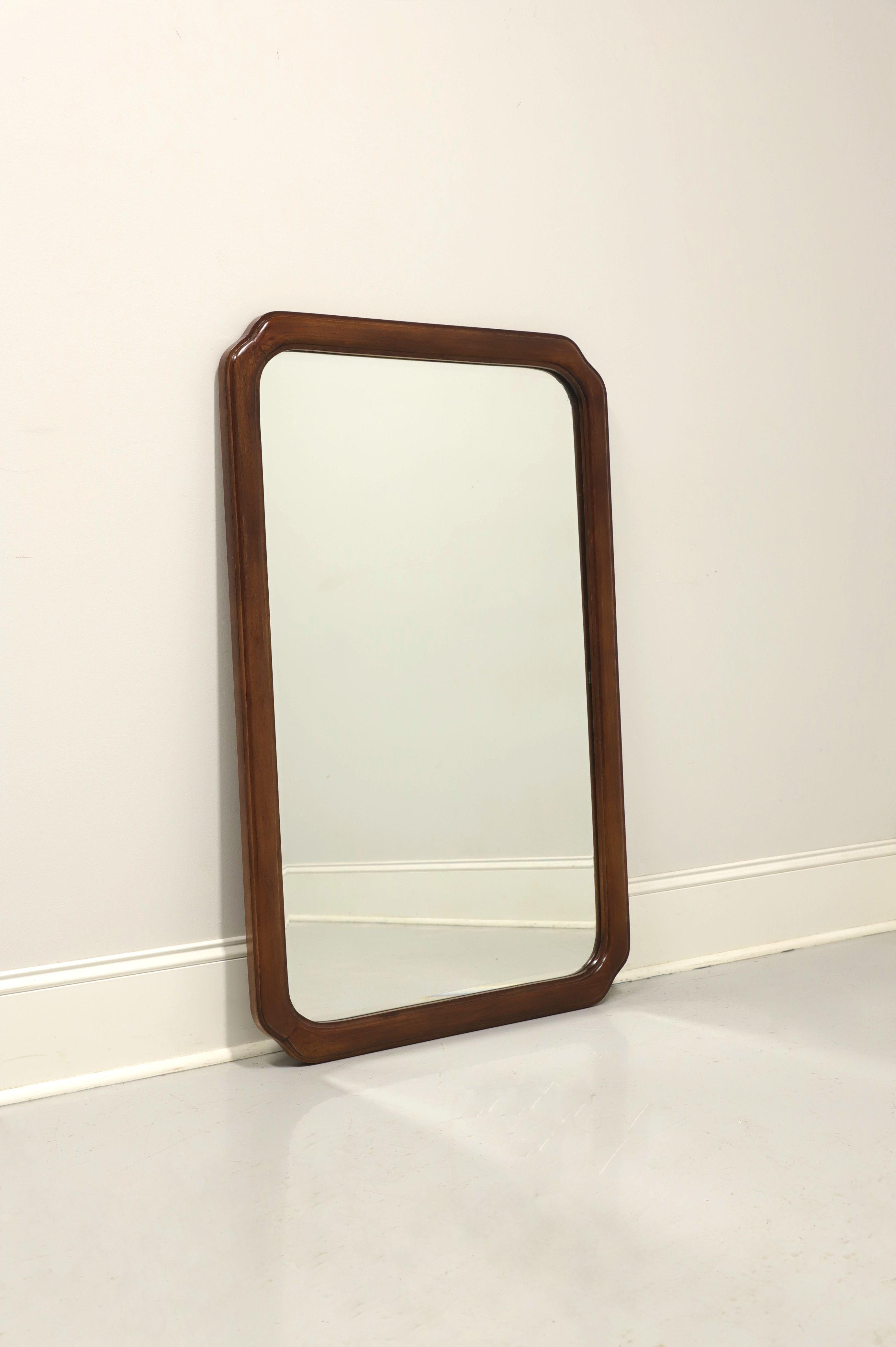 An Asian influenced dresser or wall mirror by Thomasville, from their Mystique II Collection. Beveled mirror glass in a walnut frame. Made in Thomasville, North Carolina, USA, in the late 20th Century. 

Style #: 25511-220

Measures: 29.5 W 1.5 D