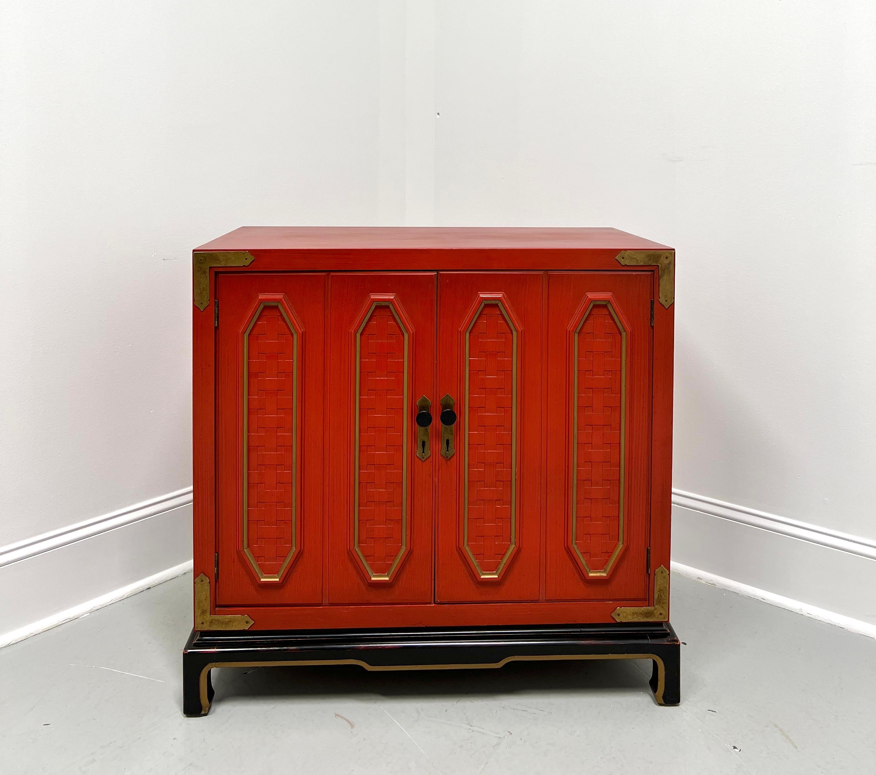 An Asian Campaign style console cabinet by Thomasville. Solid hardwood with red & black lacquer, gold painted accents, smooth square edged top, brass hardware & accents, hexagon shaped woven-look door panels, and Ming style black lacquered feet with