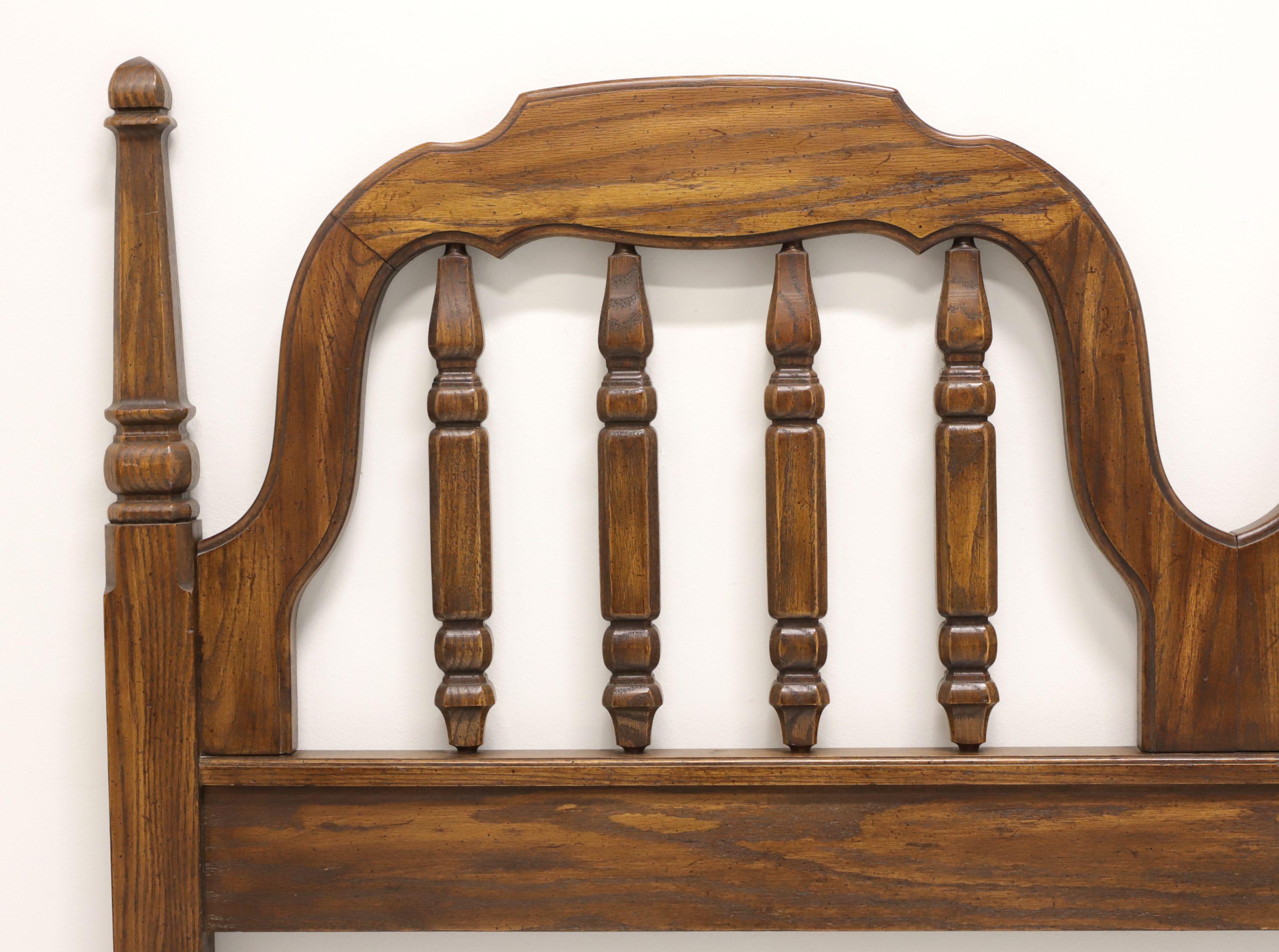 A Spanish Mediterranean style queen Size headboard by Thomasville, from their Segovia Collection. Solid oak with slightly distressed finish, Dual carved arched top, four decorative open posts within the arches, short carved posts at sides, and