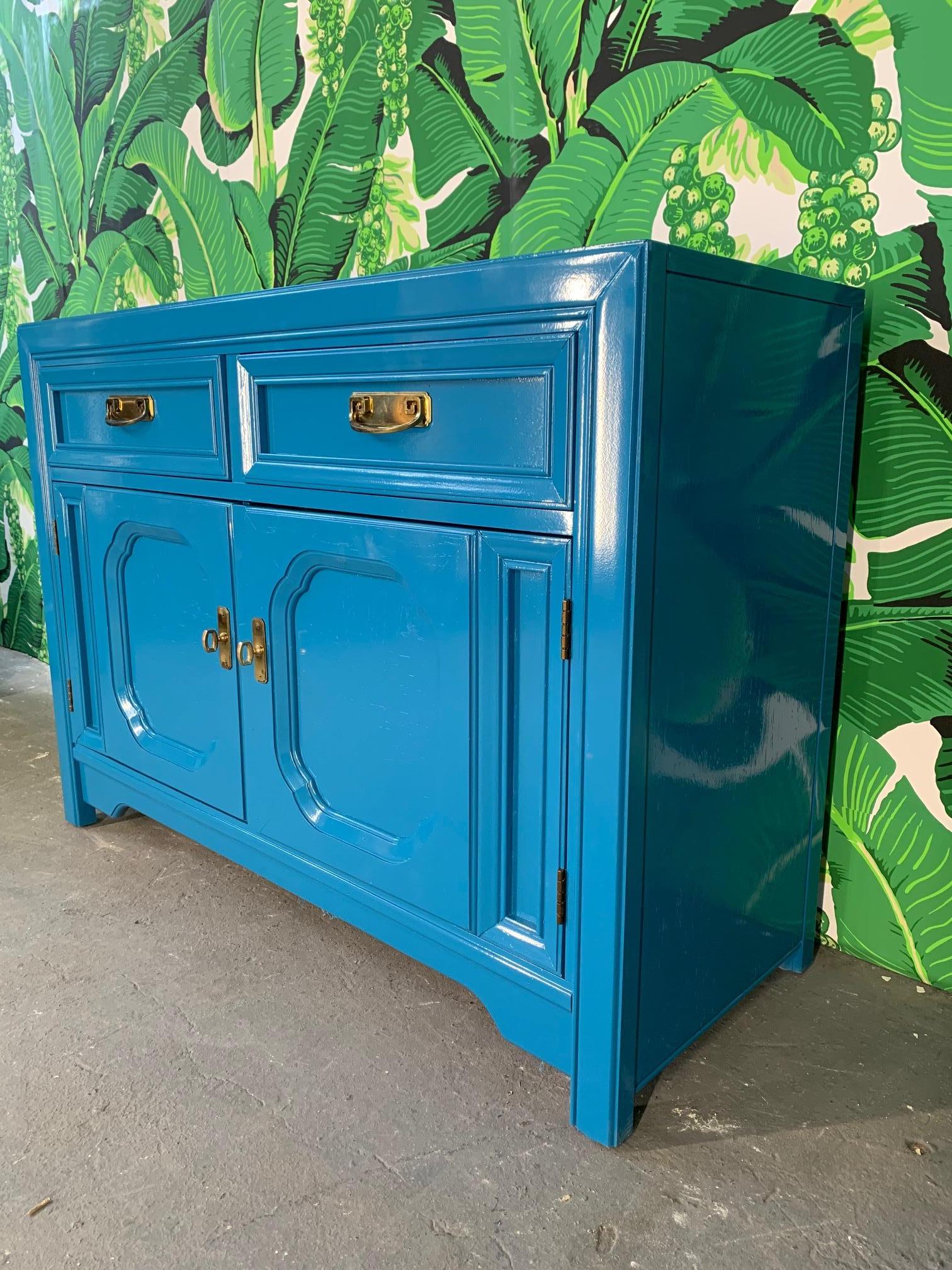 Thomasville buffet finished in high gloss blue. Original brass hardware. Very good vintage condition with minor imperfections to the newly lacquered finish.