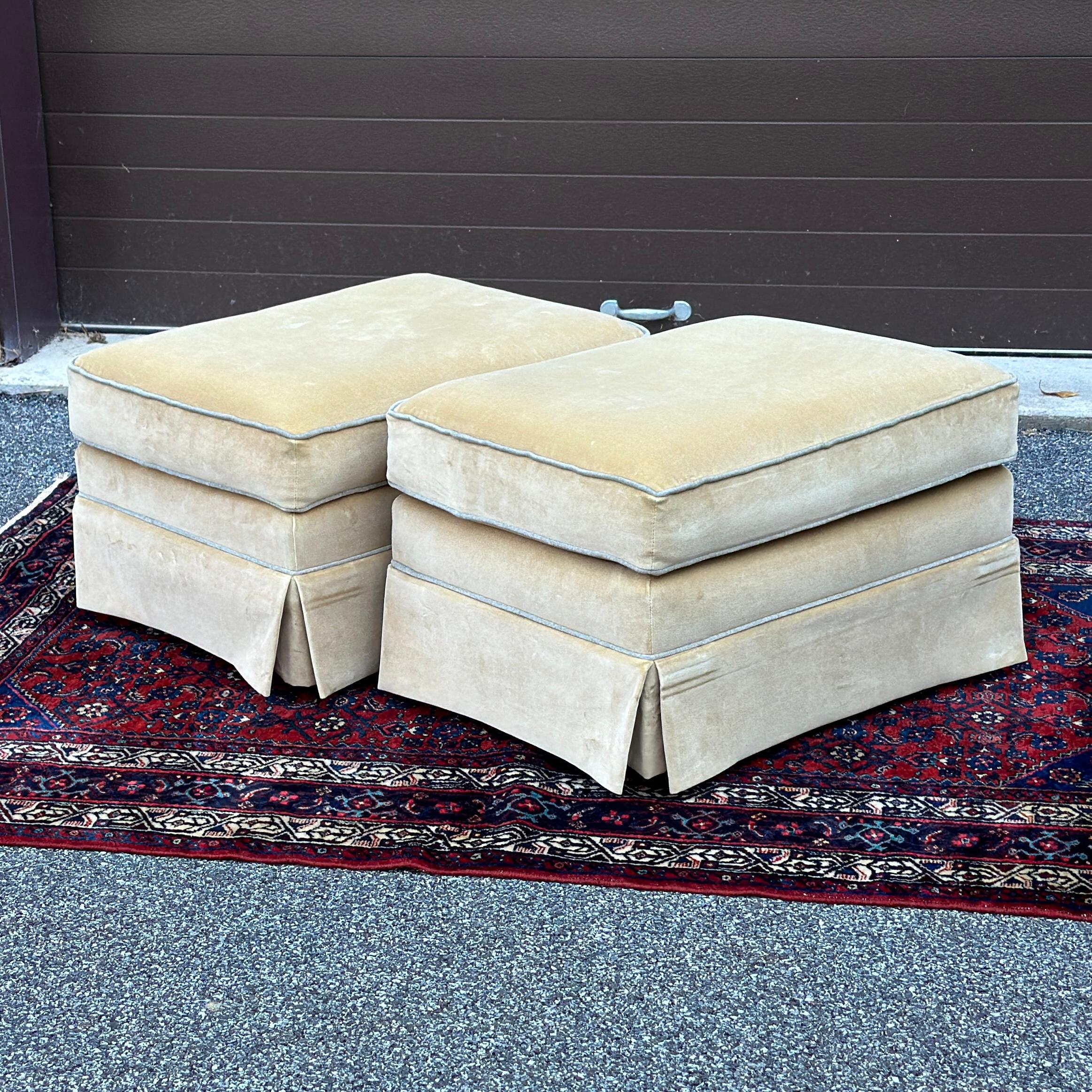 Pair of Thomasville skirted velvet ottomans on square ebonized legs.
Khaki colored upholstery with grey welting.
Made in USA circa 2007
Original tags on the underside of both.
Wear to upholstery as pictured.
