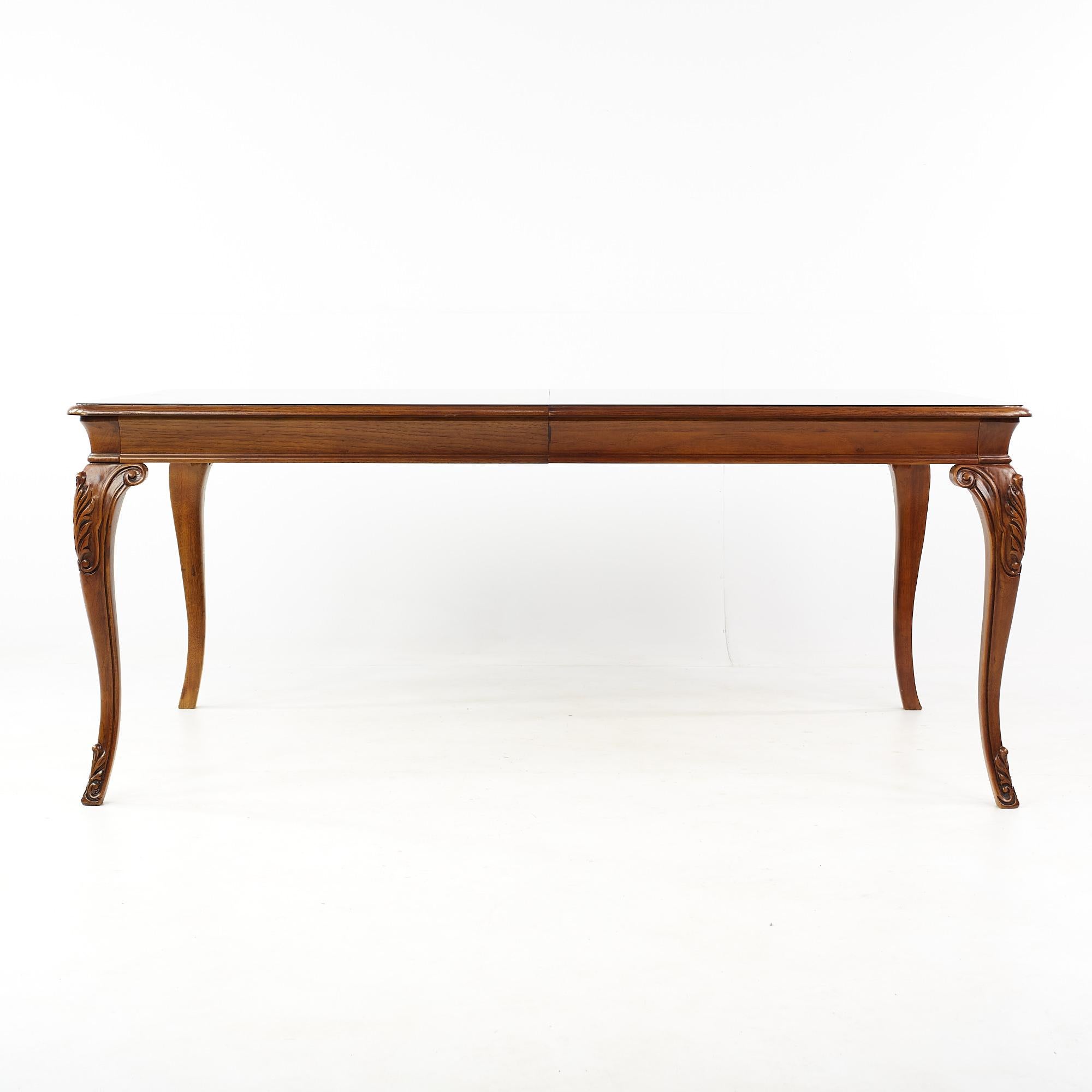 Thomasville walnut and burlwood expanding dining table with 2 leaves

This table measures: 72.5 wide x 44.25 deep x 30 high, with a chair clearance of 25.5 inches, each leaf measures 22.25 inches wide, making a maximum table width of 117 inches