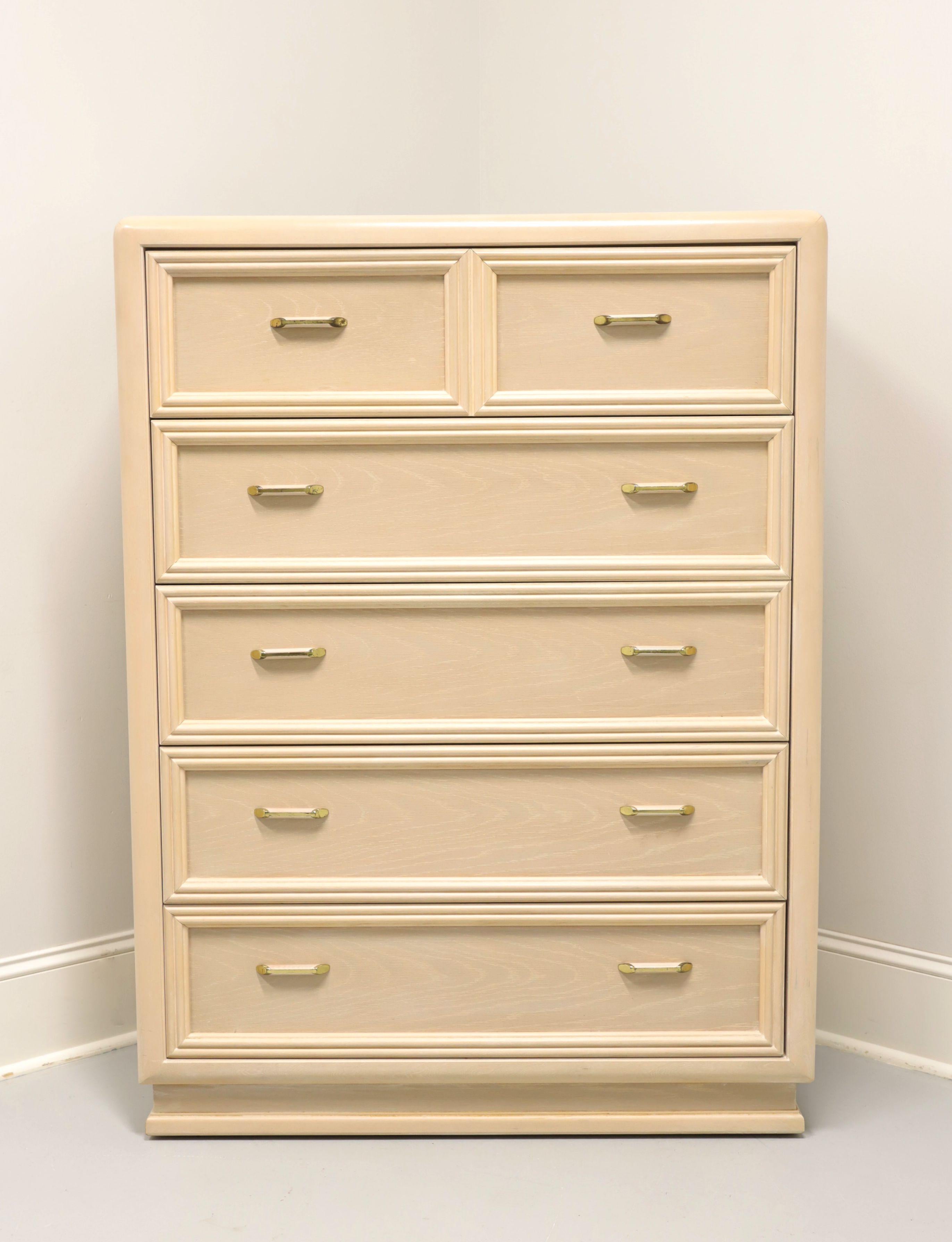 A Post-Modern style chest of drawers by Thomasville. Oak with a whitewashed finish, brass & wood hardware, waterfall edges, and a solid base. Features five drawers of dovetail construction. Made in North Carolina, USA, in the late 20th