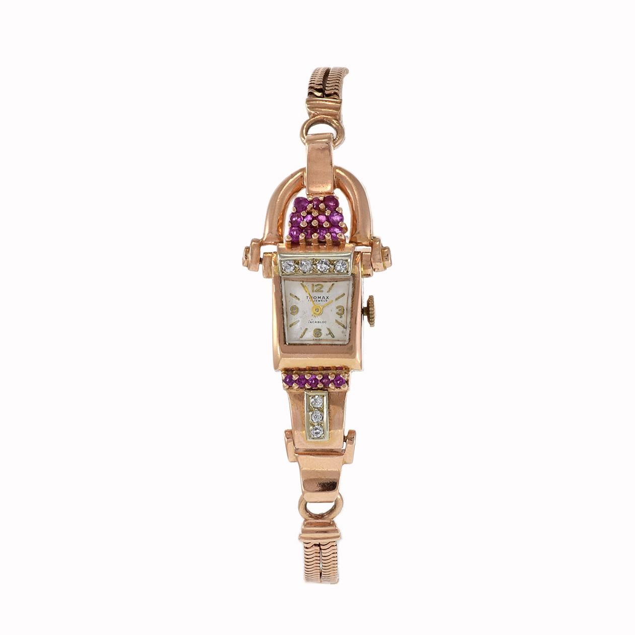 Introducing the exquisite Thomax 1950's Ladies Ruby and Diamond Cocktail Watch, a timeless embodiment of luxury and elegance. Crafted with precision, this captivating timepiece features a 14kt pink gold case and bracelet adorned with radiant rubies