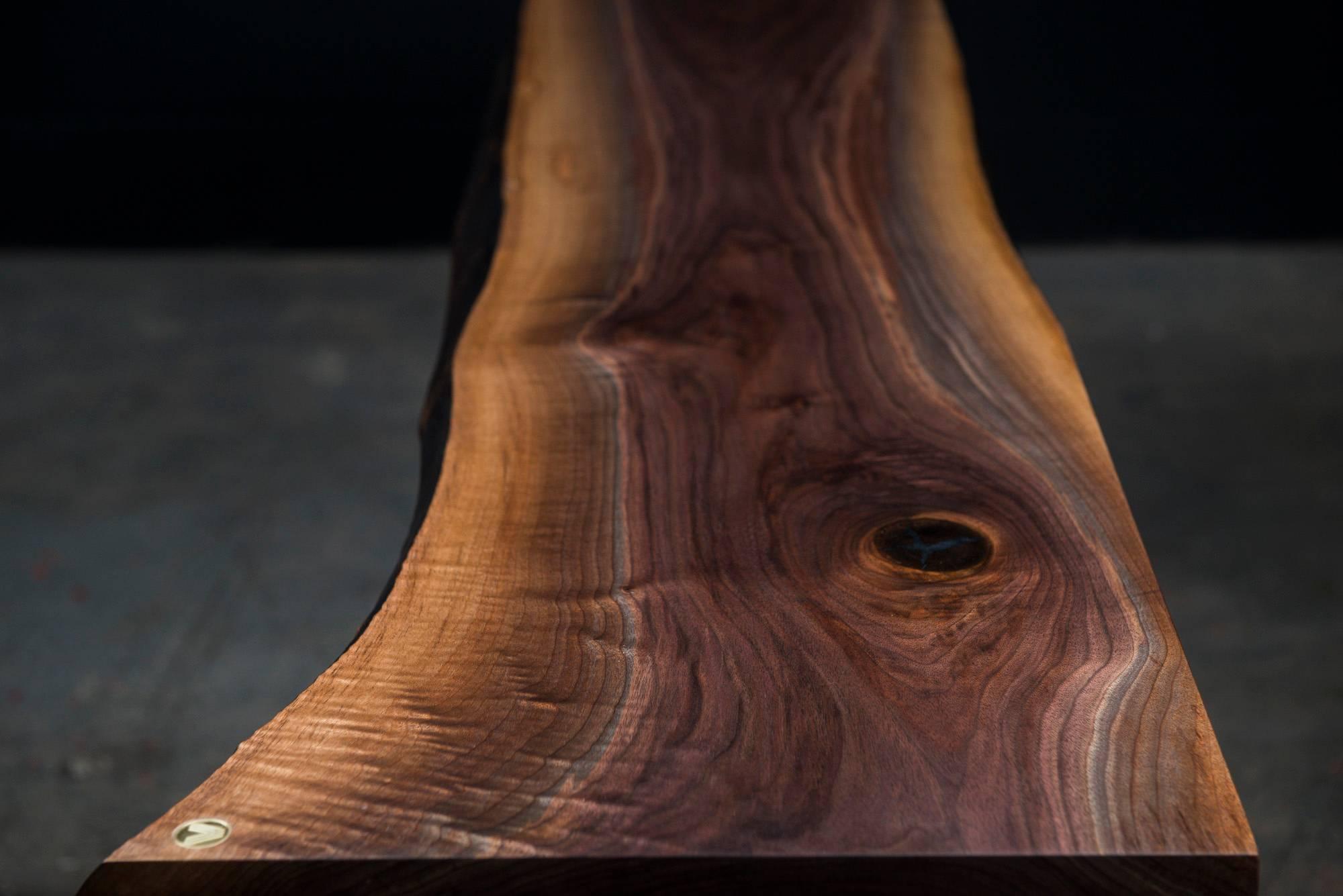 Our Thompson console table handmade to order from an hand selected unique walnut slab with an hand rubbed natural oil and wax finish that enhance the real beauty of the wood and give a natural warm touch. The elegant style came from our signature