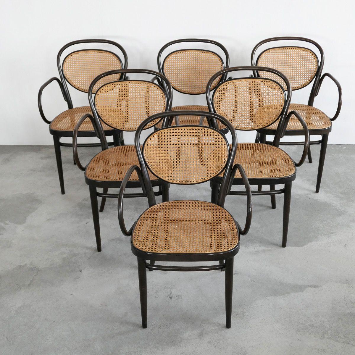 Thonet 215RF armchairs, set of 6. Germany, late 1970s.

Beautiful set of 6 bentwood armchairs by Thonet. This is model 215RF, which means 'coffee house' with arm rests. 

Great color and combination of bentwood and webbing. Very fashionable and
