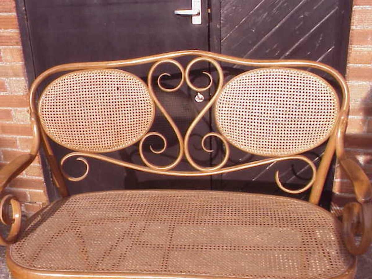 Thonet, A Bentwood Settee with Scrollwork Decoration with a Caned Seat & Back In Good Condition For Sale In London, GB